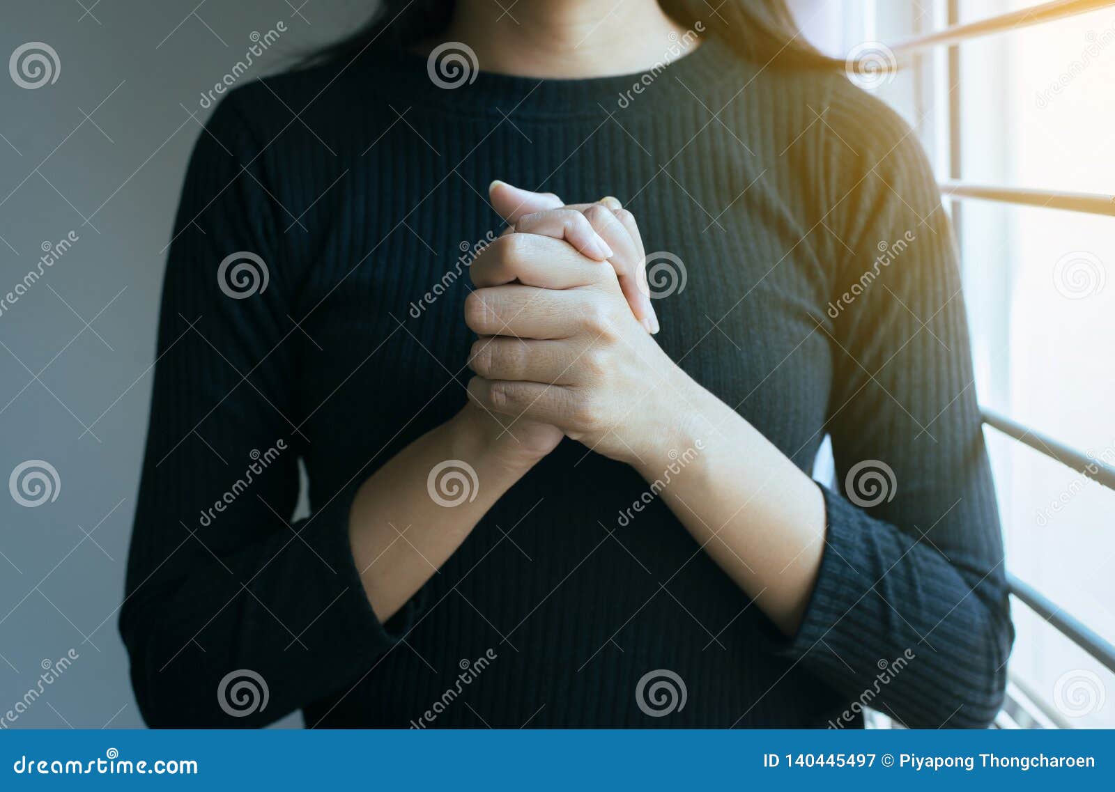 close up of hand woman in praying position,female pay respect or put your hands together in a prayer position