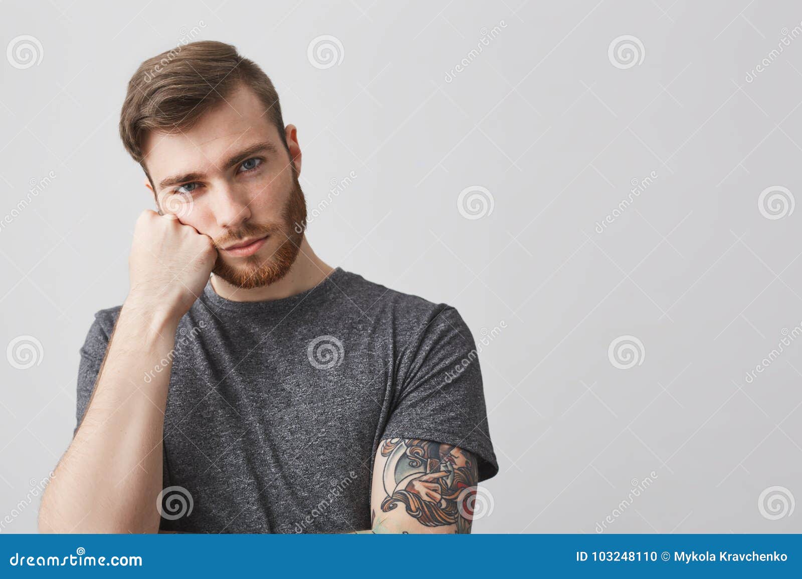 Close Up of Handsome Caucasian Man with Beard and Tattoo on Arm Holding Head with Hand, Looking in Camera with Bored Stock Photo - Image of bored, handsome: 103248110 Close Up of Handsome Caucasian Man with Beard and Tattoo on Arm Holding Head with Hand, Looking in Camera with Bored Stock Photo - Image of bored, handsome: 103248110