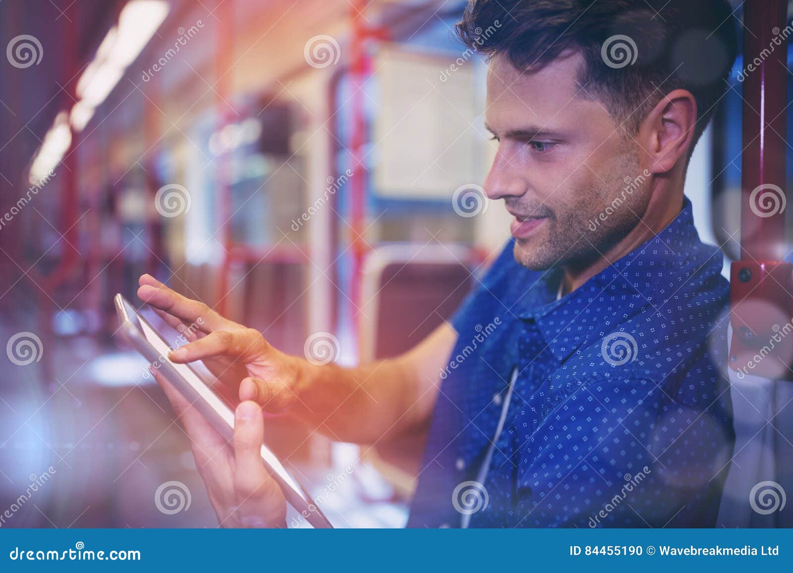 Close Up Of Handsome Man Using Digital Tablet In Train