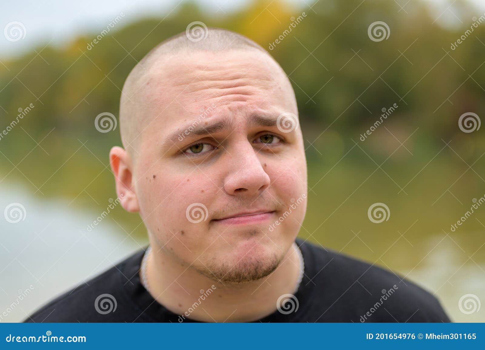 Young man shaved head
