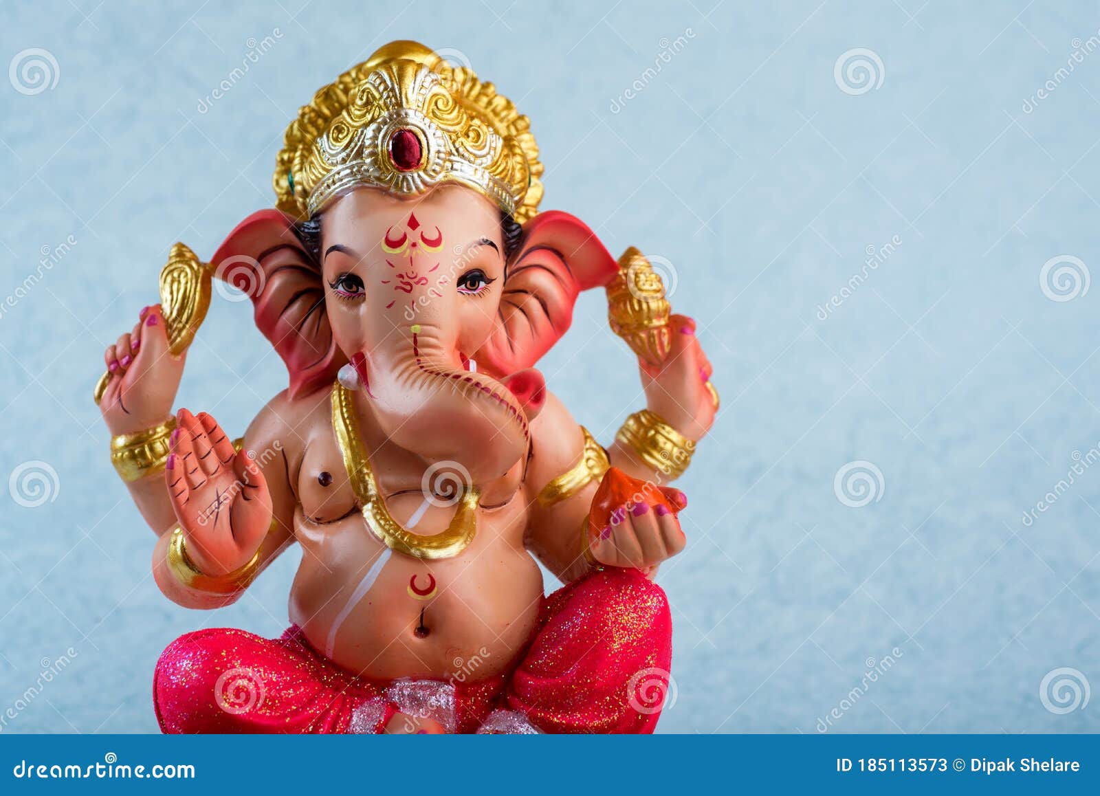 Hindu God Ganesha. Ganesha Idol on Blue Background Stock Image ...
