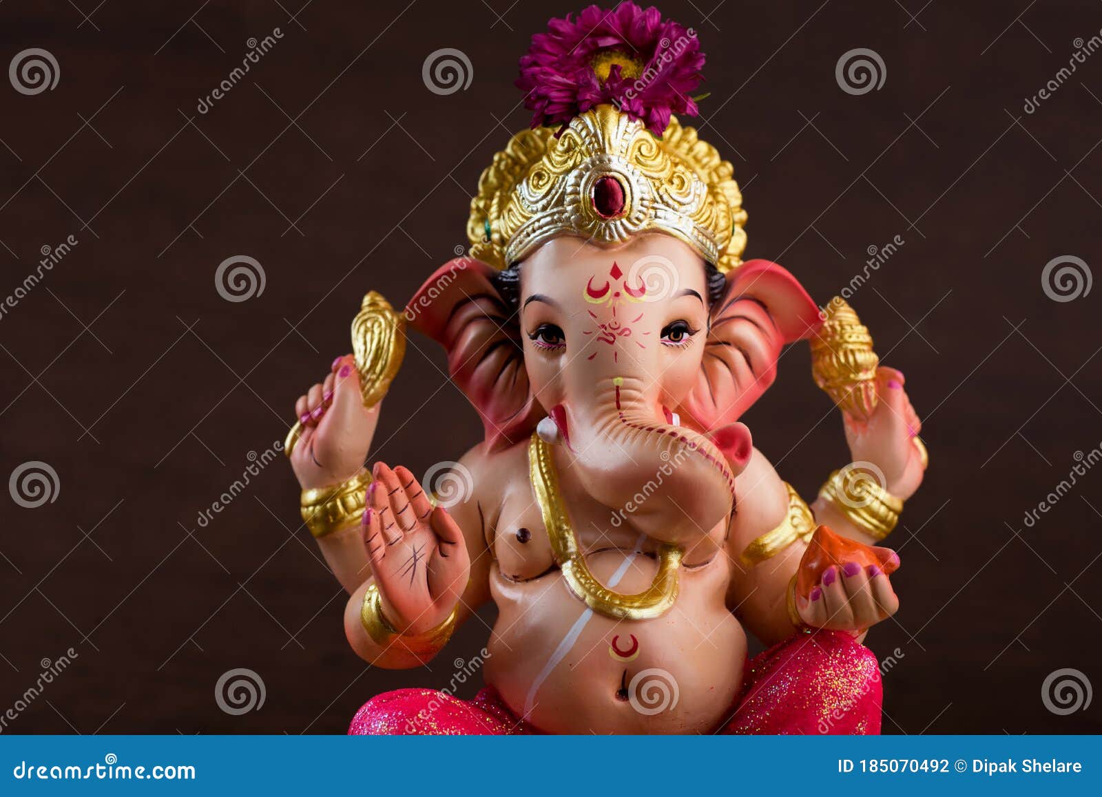 Hindu God Ganesha. Ganesha Idol On Dark Wooden Background Stock Photo  185070492 - Megapixl