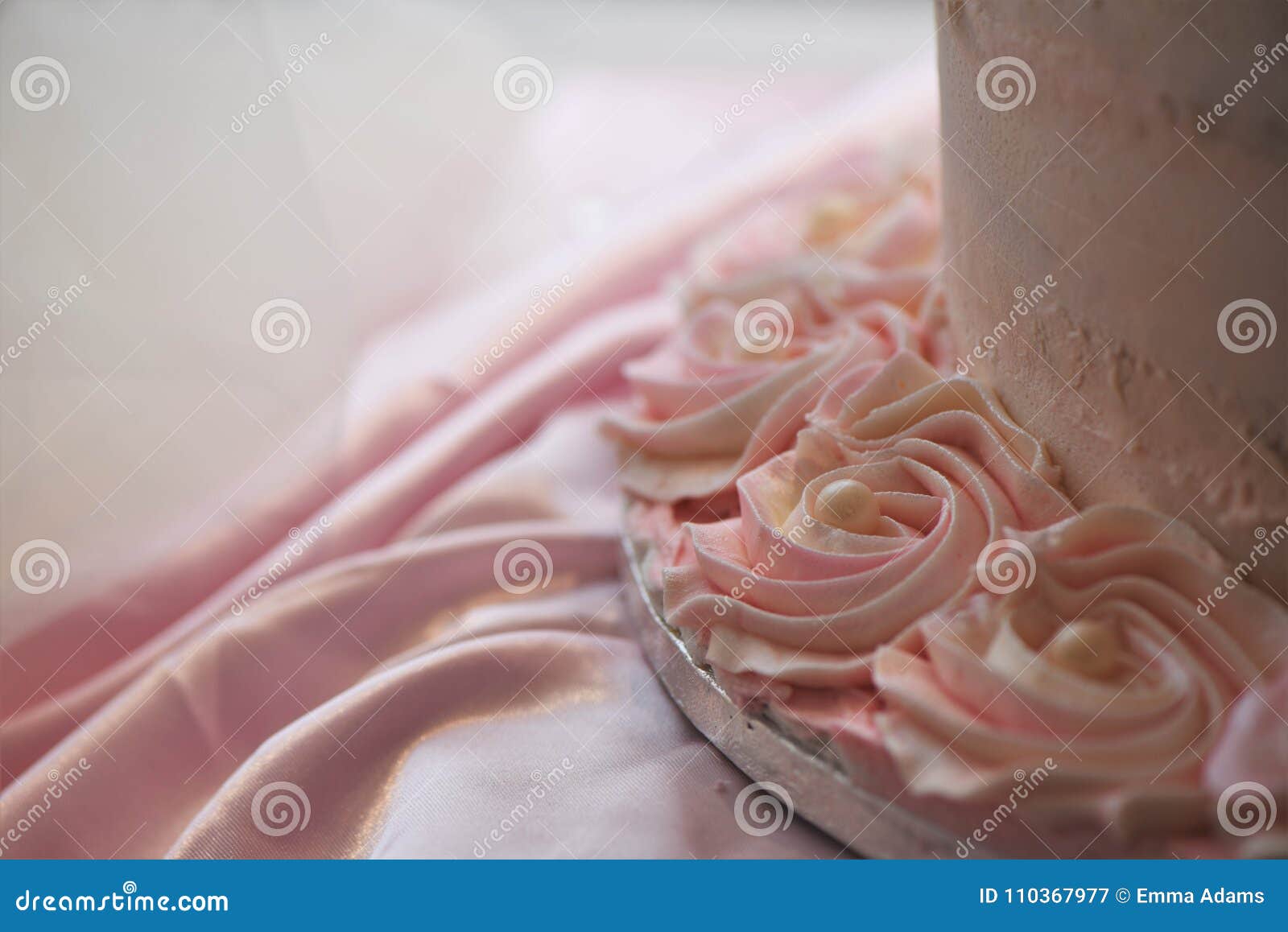 Close Up of Iced Pink Flowers and Pearl Decorations on a Wedding