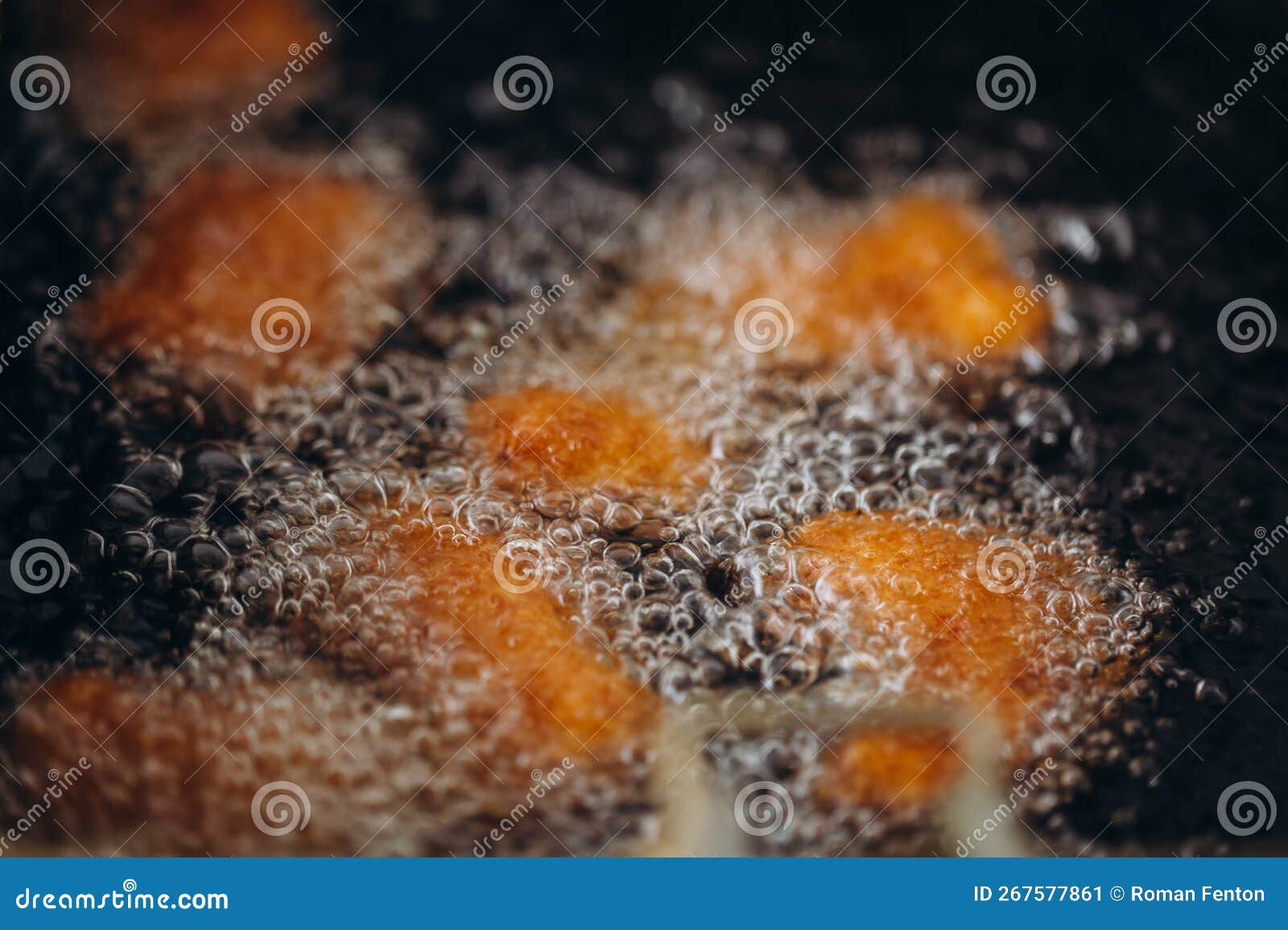 Close Up Image of Cooking Chicken Nugget Tempura in Deep Fry Stock