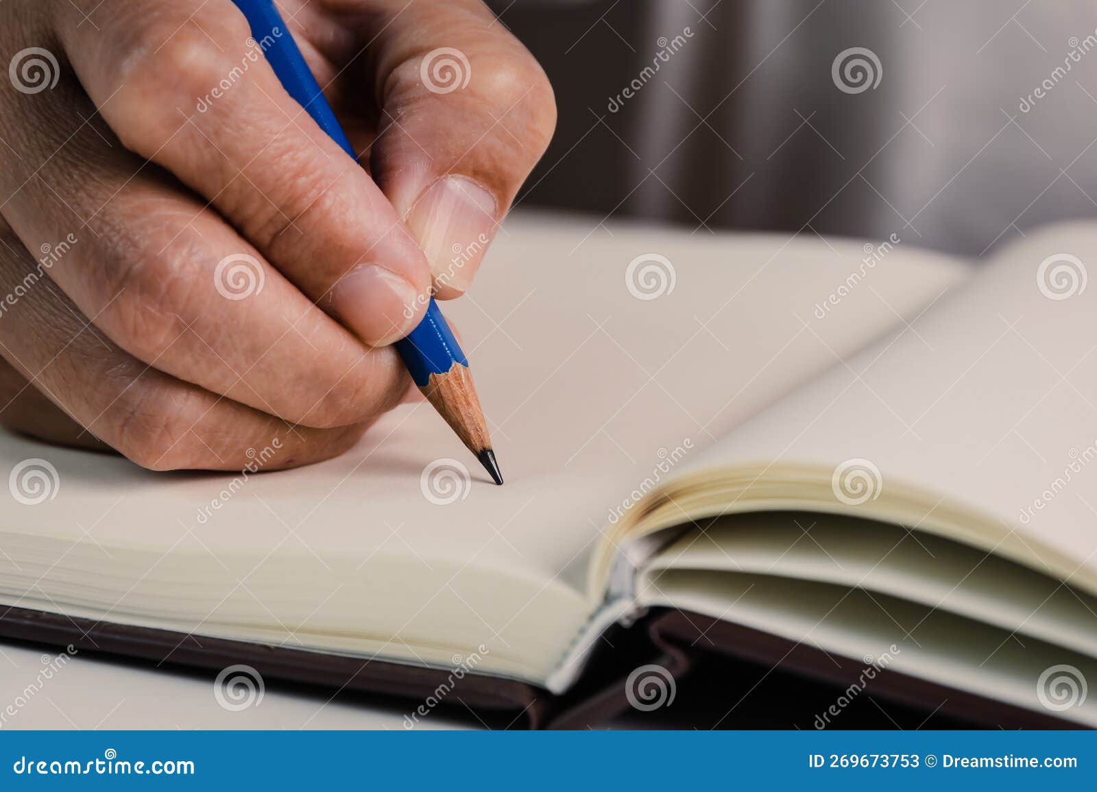 Pencil in People S Hand Start Writing Down Something in the Empty Open