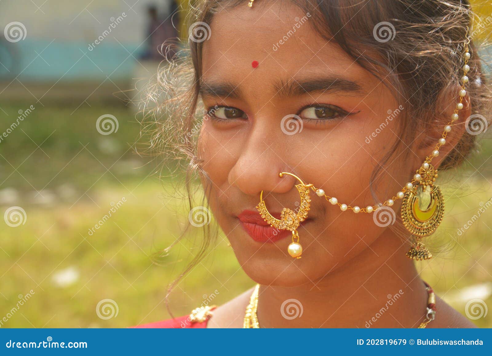 close up indian bengali teenage girl wearing traditional jewellery like nose ring ear rings red bindi forehead teen 202819679