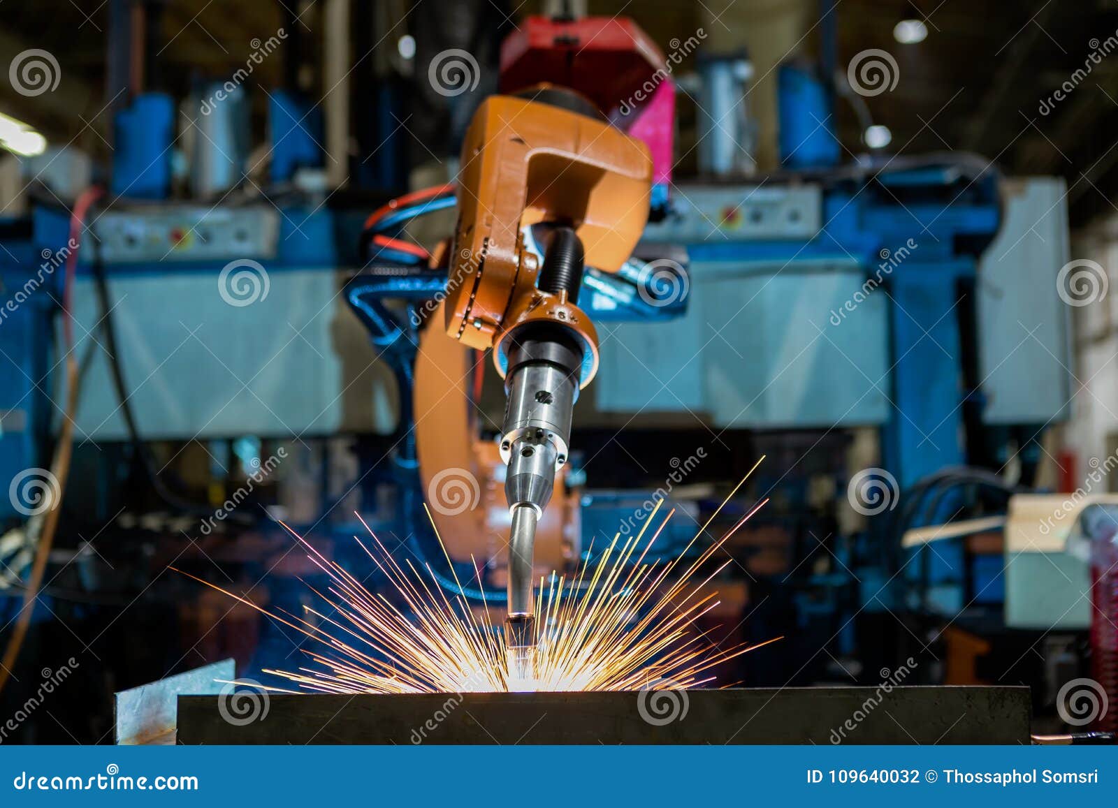 close-up industrial robot is welding in a car factory