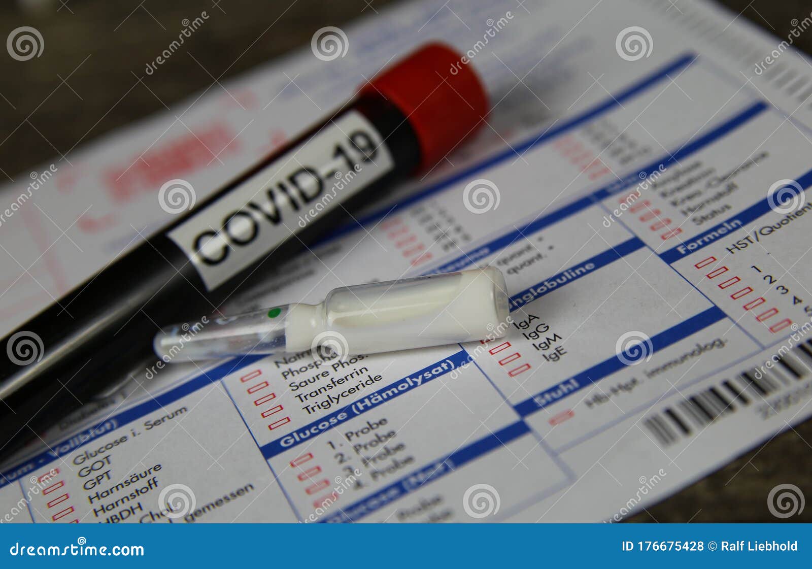 Close Up of Isolated Blood Sample Tube with Word Covid-19 and White ...