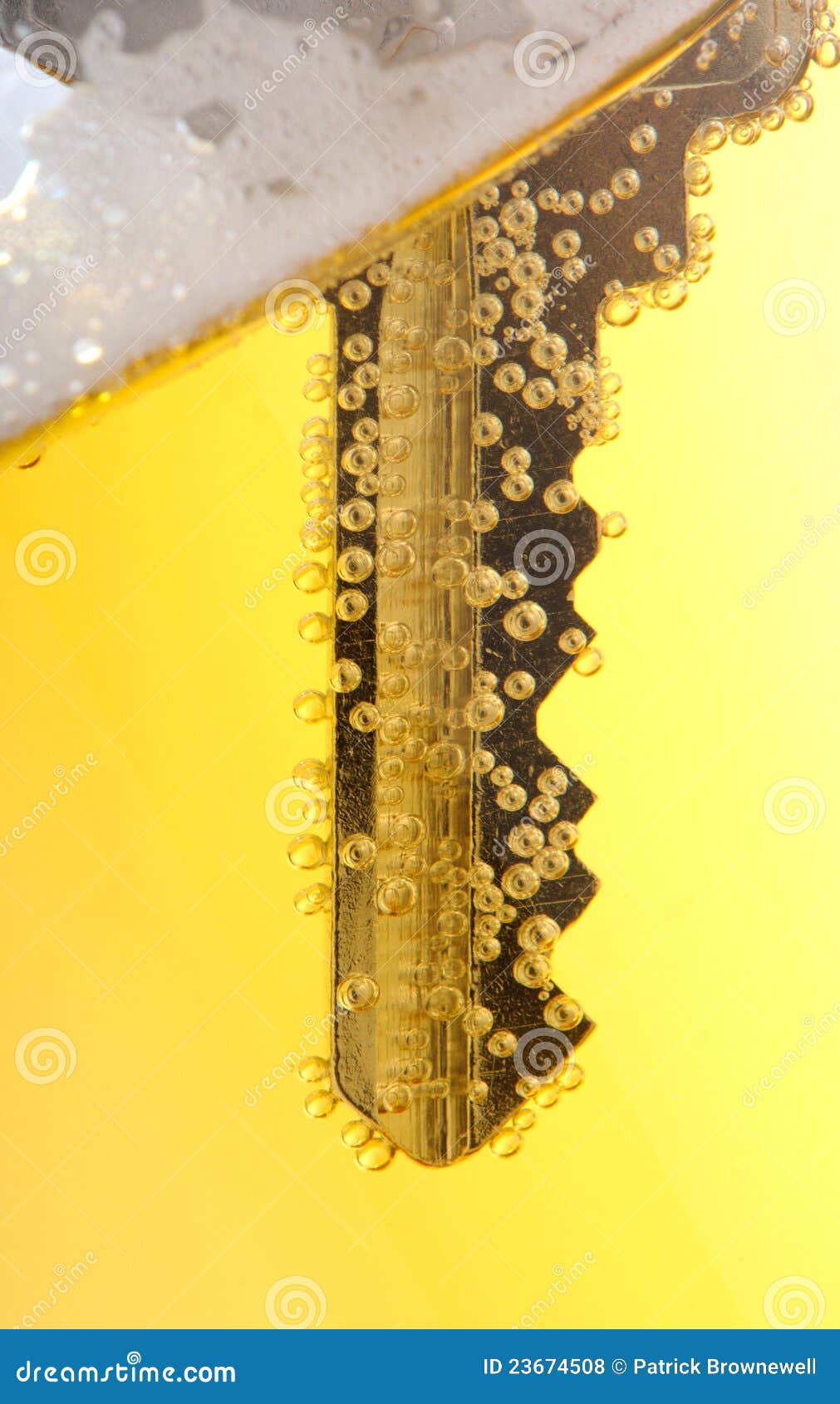 Close up key in beer stock photo. Image of glass, beer 23674508