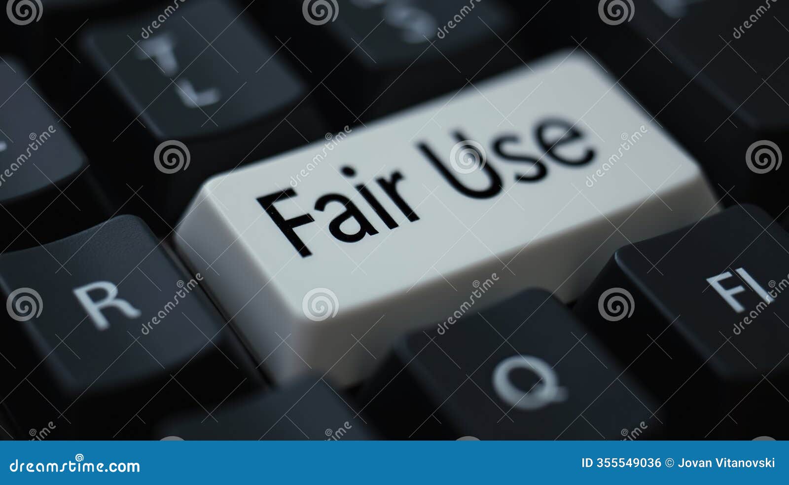 close-up of keyboard with a custom white 'fair use' keycap highlighted