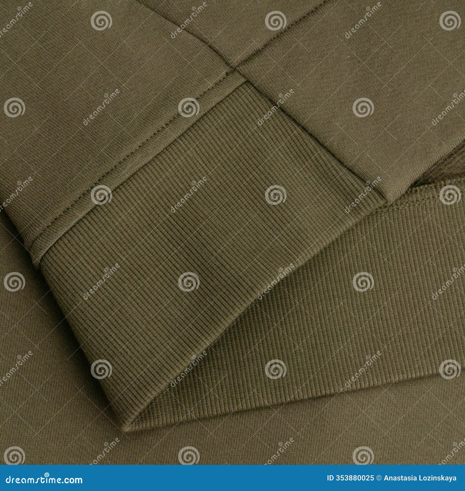 close-up of khaki sweatshirt texture and ribbed hem