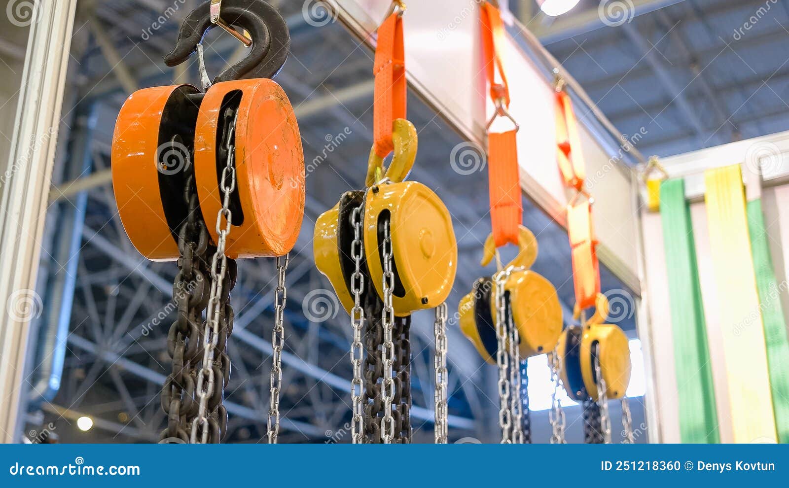 Closeup of Large Hanging Industrial Hooks with Chains. Stock Photo