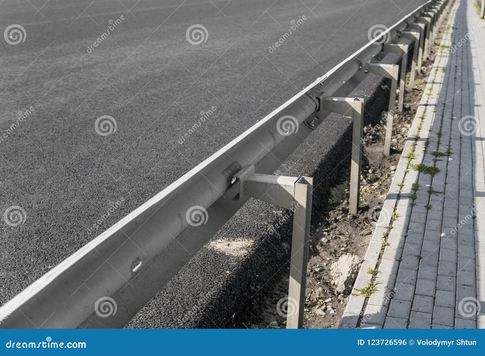 Close-up on a Layer of New Asphalt at the Road Under Construction with ...