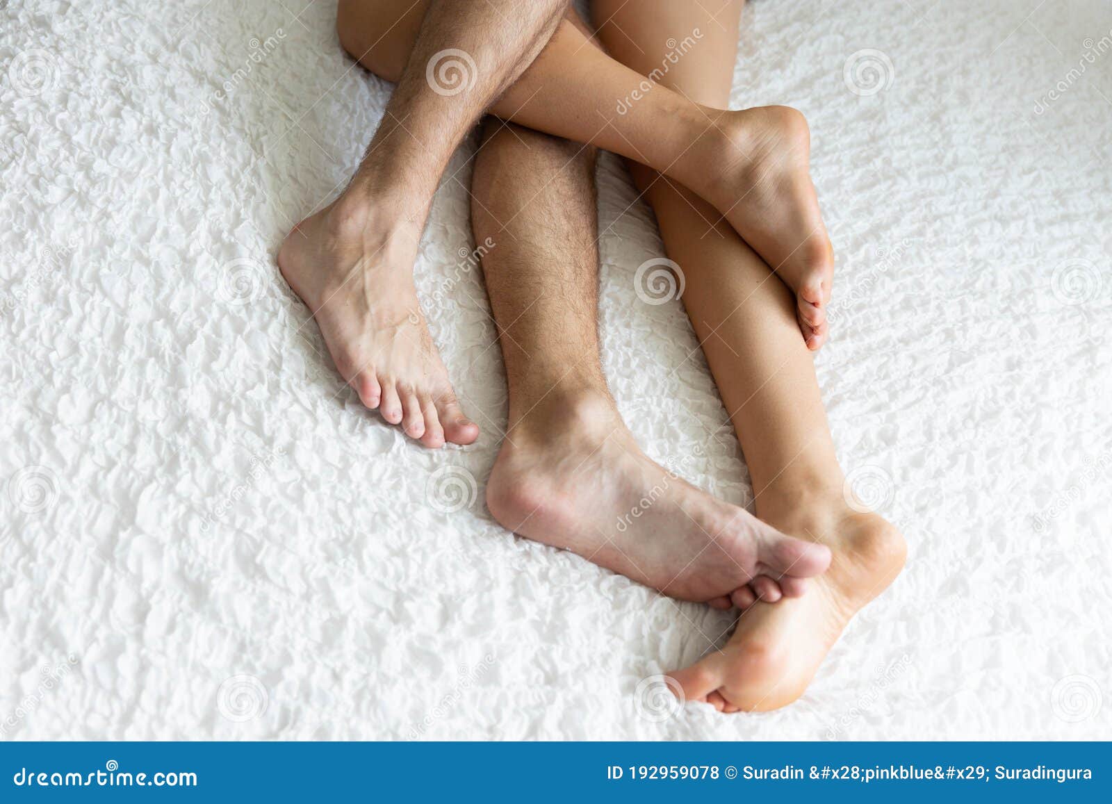 Close Up Legs of a Couple in Love Lying in Bed Stock Photo - Image of  people, male: 192959078