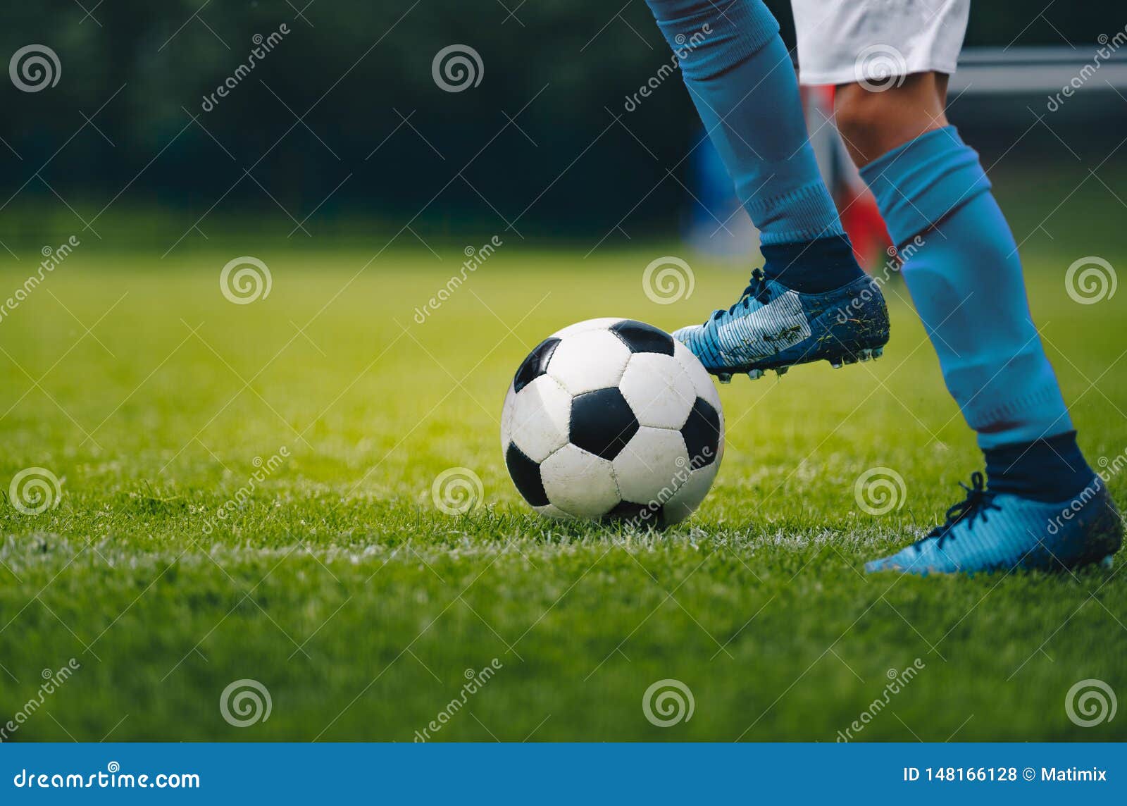 Close Up Of Legs And Feet Of Football Player In Blue Socks And Shoes Running And Dribbling With The Ball Stock Photo Image Of Club Improve