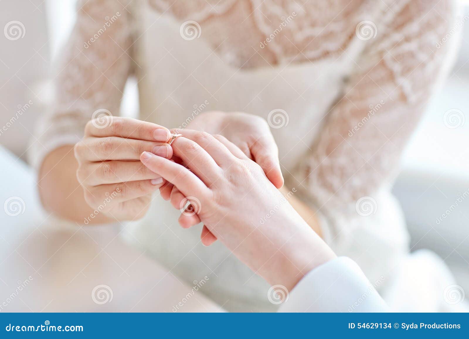 Close Up of Lesbian Couple Hands with Wedding Ring Stock Photo pic
