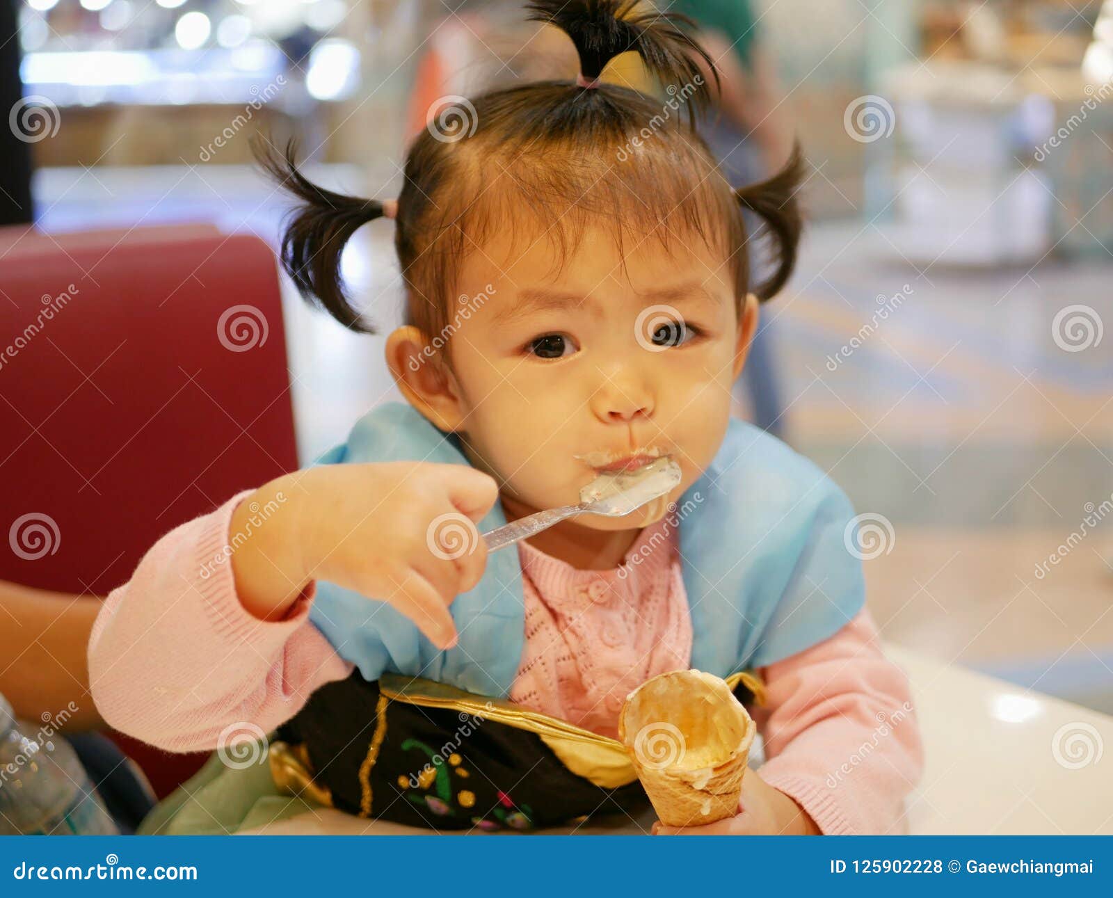 Little Asian Baby Girl Scooping Ice Cream Stock Photo - Image of teeth ...