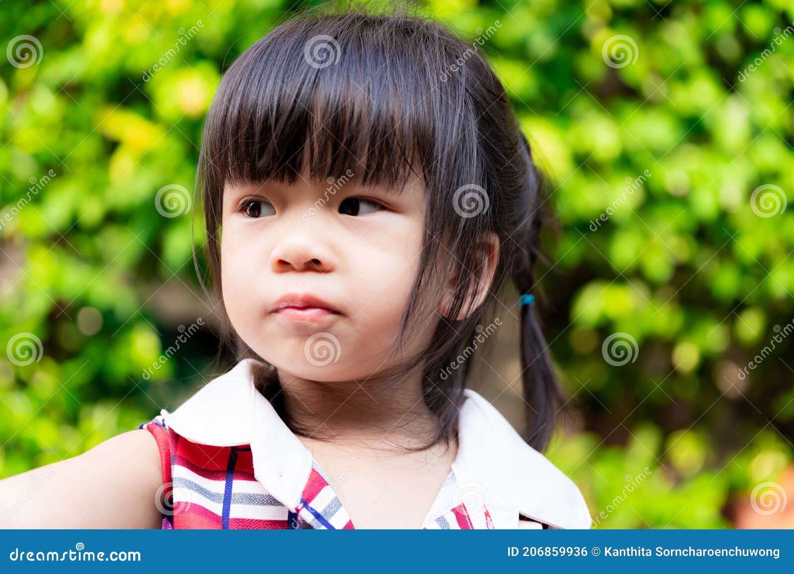 Close Up of Little Child Face is Looking at Something Wondering from Her  Side. Cute Girl Cut the Bangs Stock Photo - Image of outdoor, children:  206859936