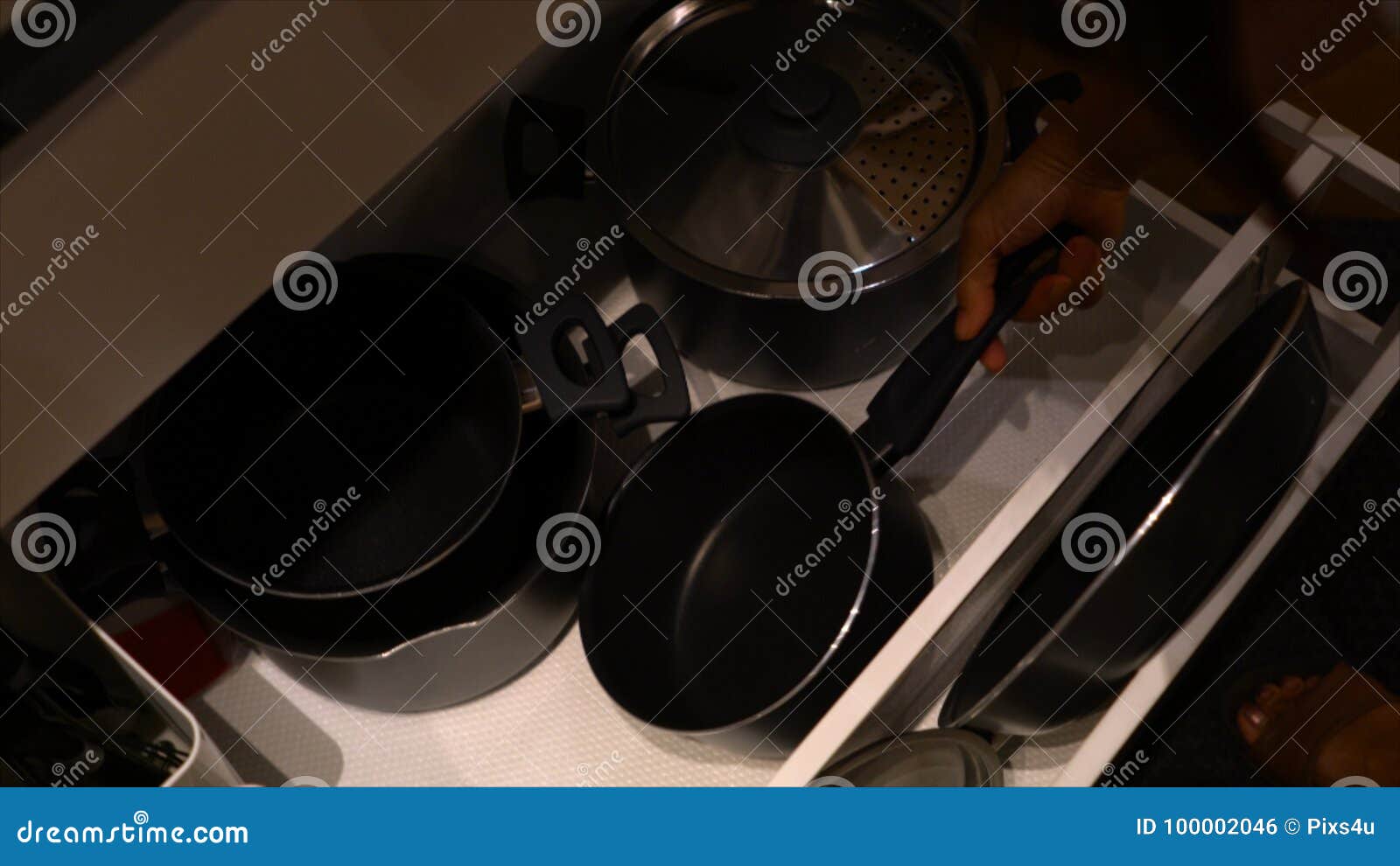 The Hand Pull Out Drawer To Keep The Pot And Pan Stock Photo