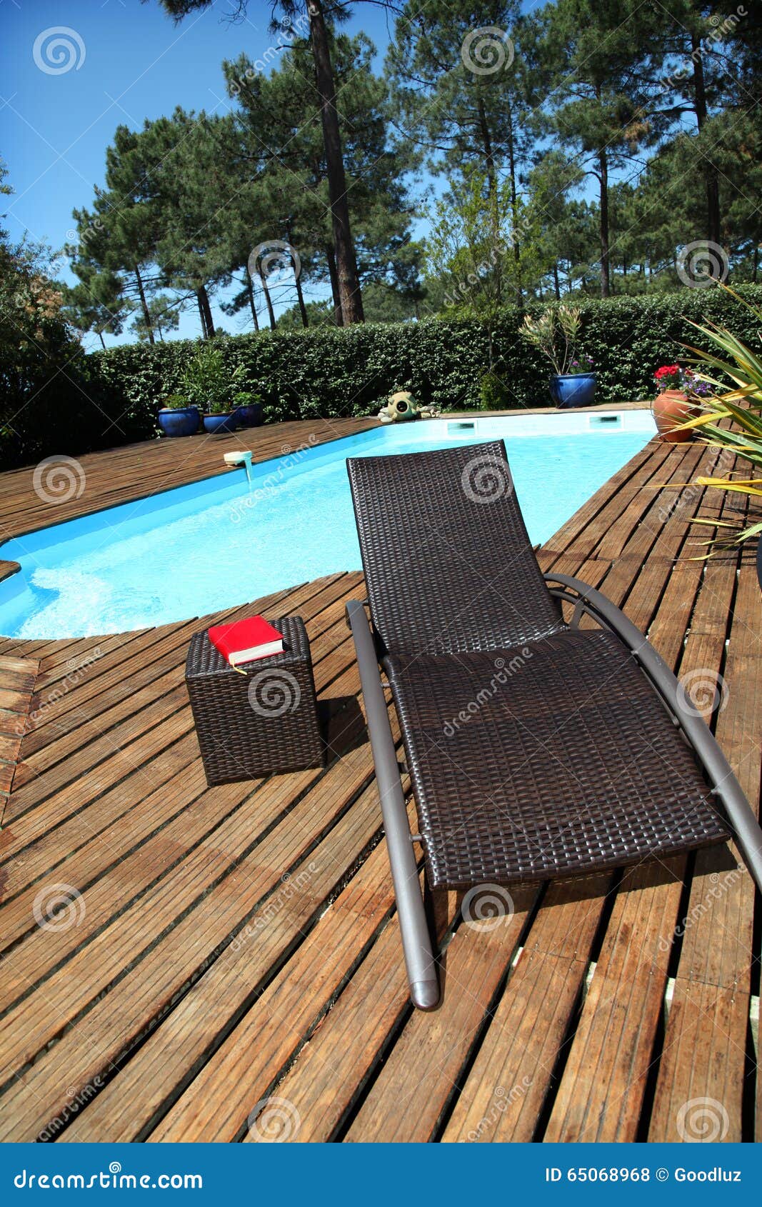 Close Up Of Long Chair By The Swimming Pool Stock Photo