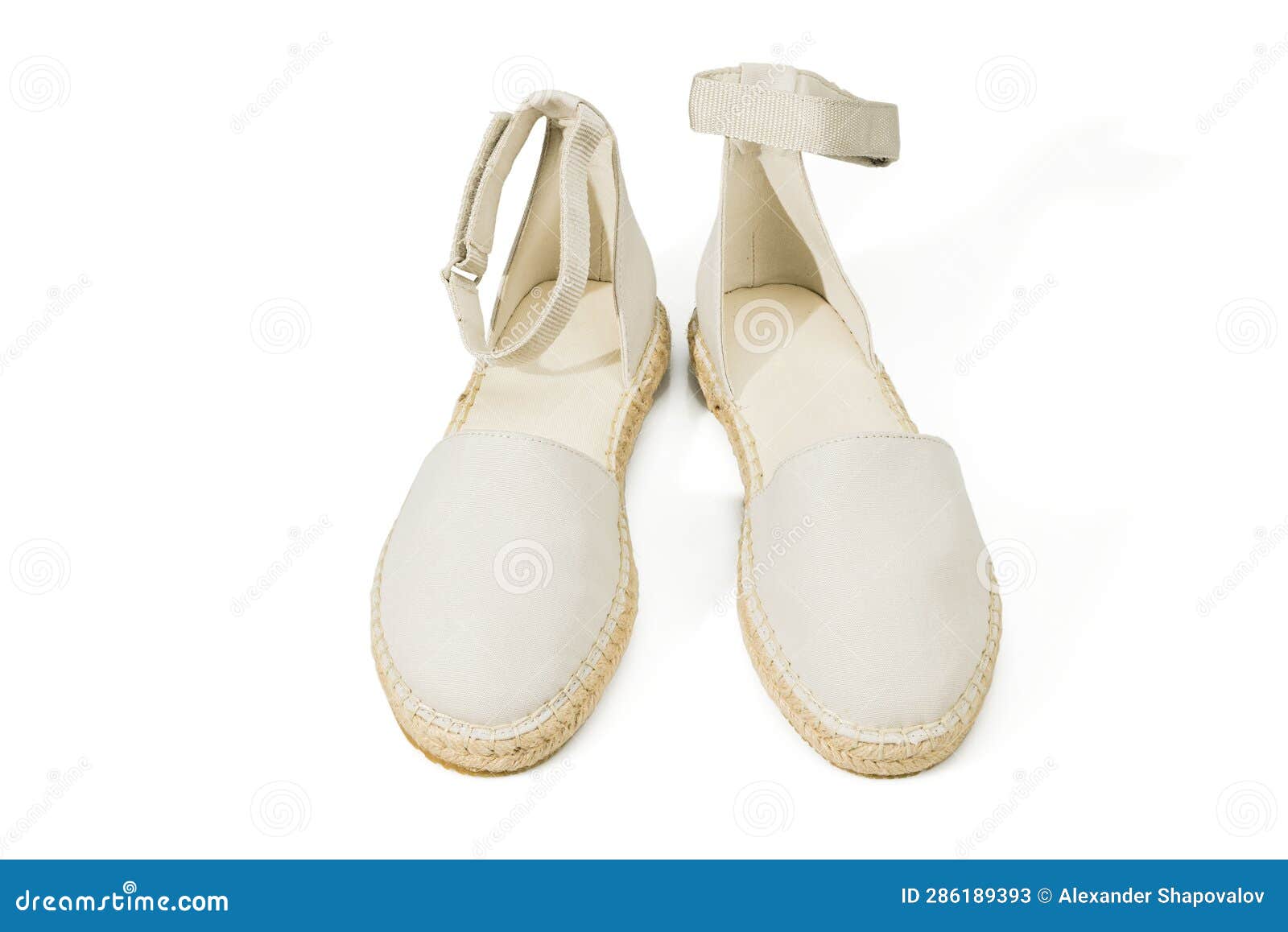 Closeup Macro View of Eggshell Espadrilles Shoes on White Background
