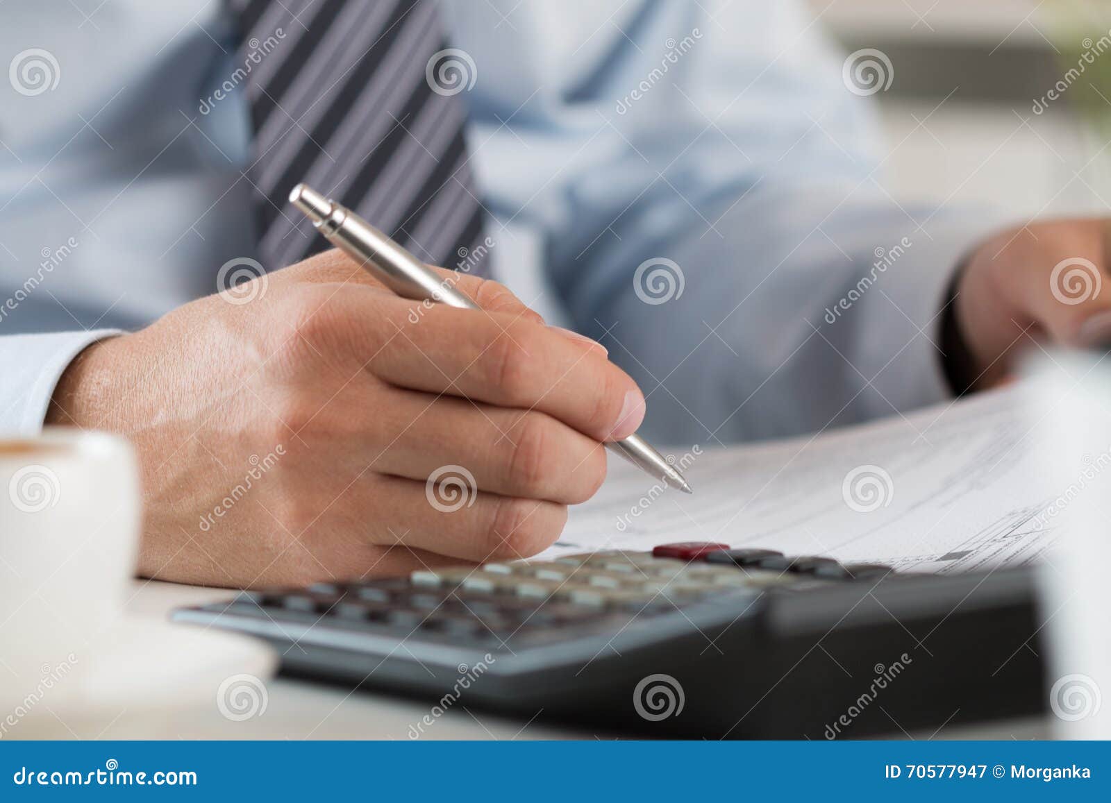 close up of male accountant making calculations