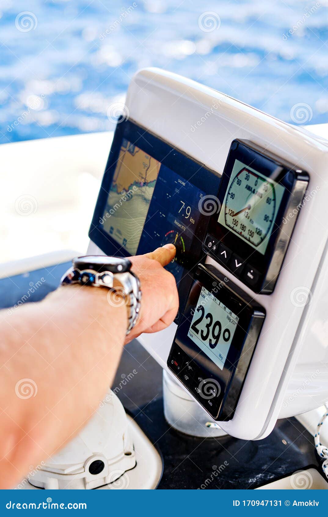 close up hand pointing on navigation devices in catamaran deck, adventure recreational sport, yachting concept