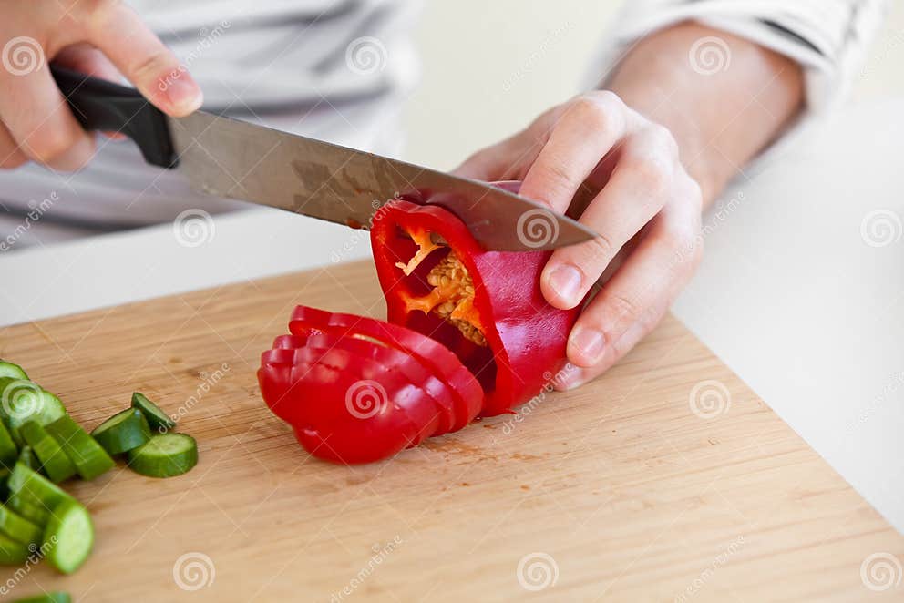 Closeup of a Man Cutting Red Pepper in Kitchen Stock Photo Image of