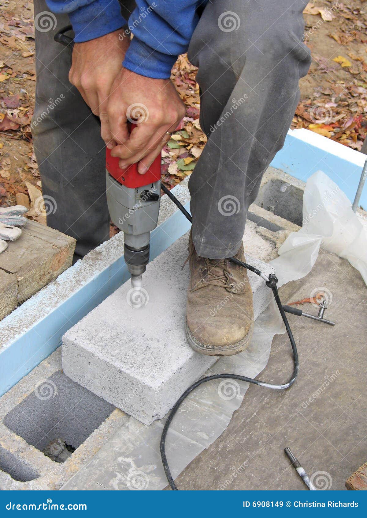 Close-up Of Man Drilling Concrete Block Royalty Free Stock Images