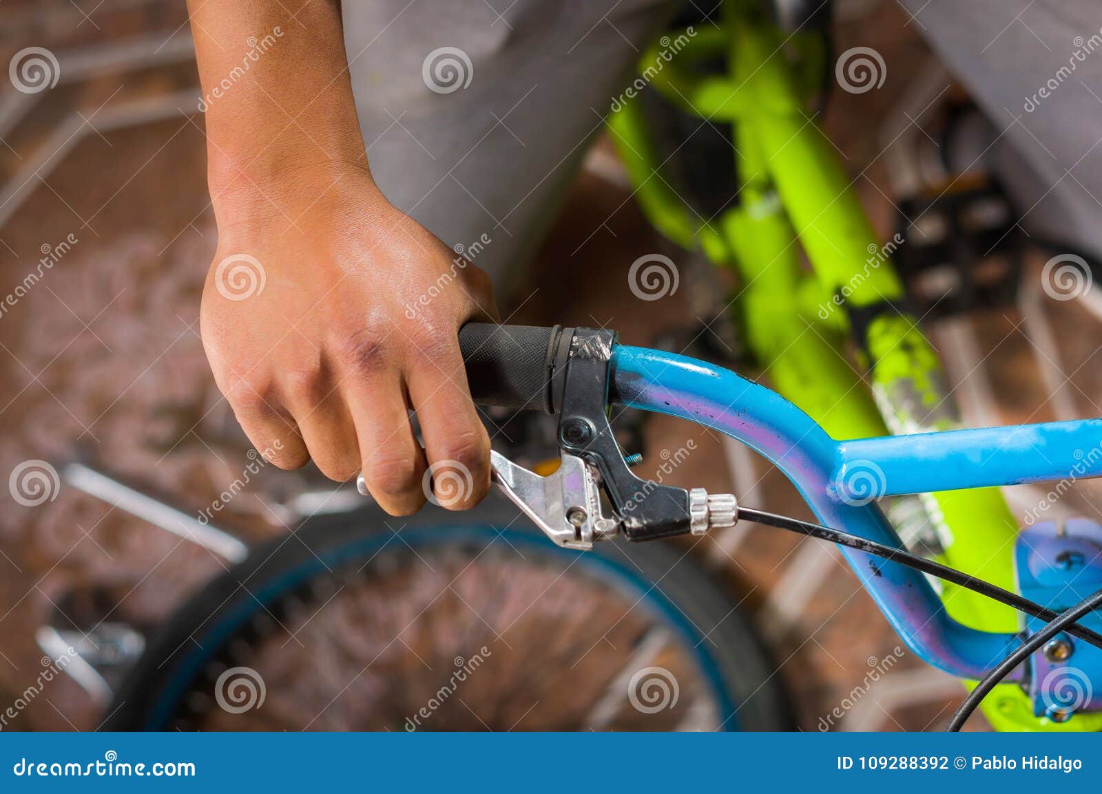 Close Up of Man Fixing the Handlebar of the Bicycle, in a
