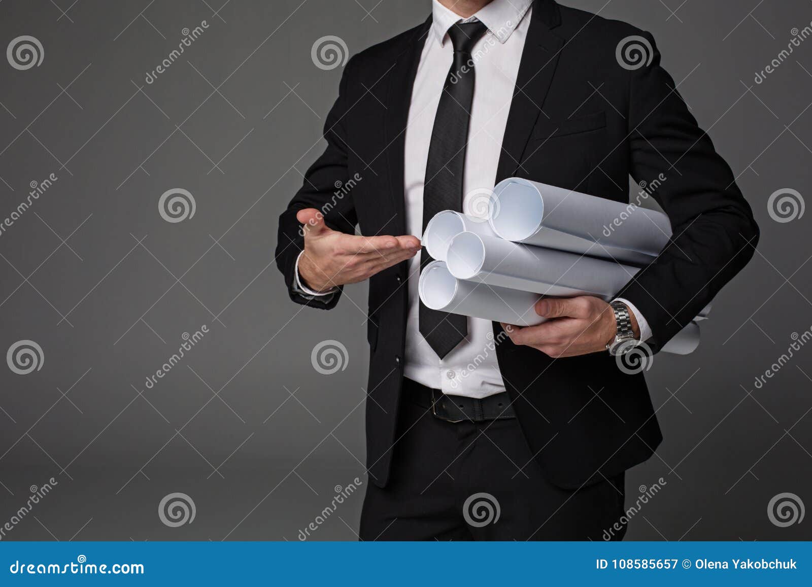 master-builder arm pointing at plans