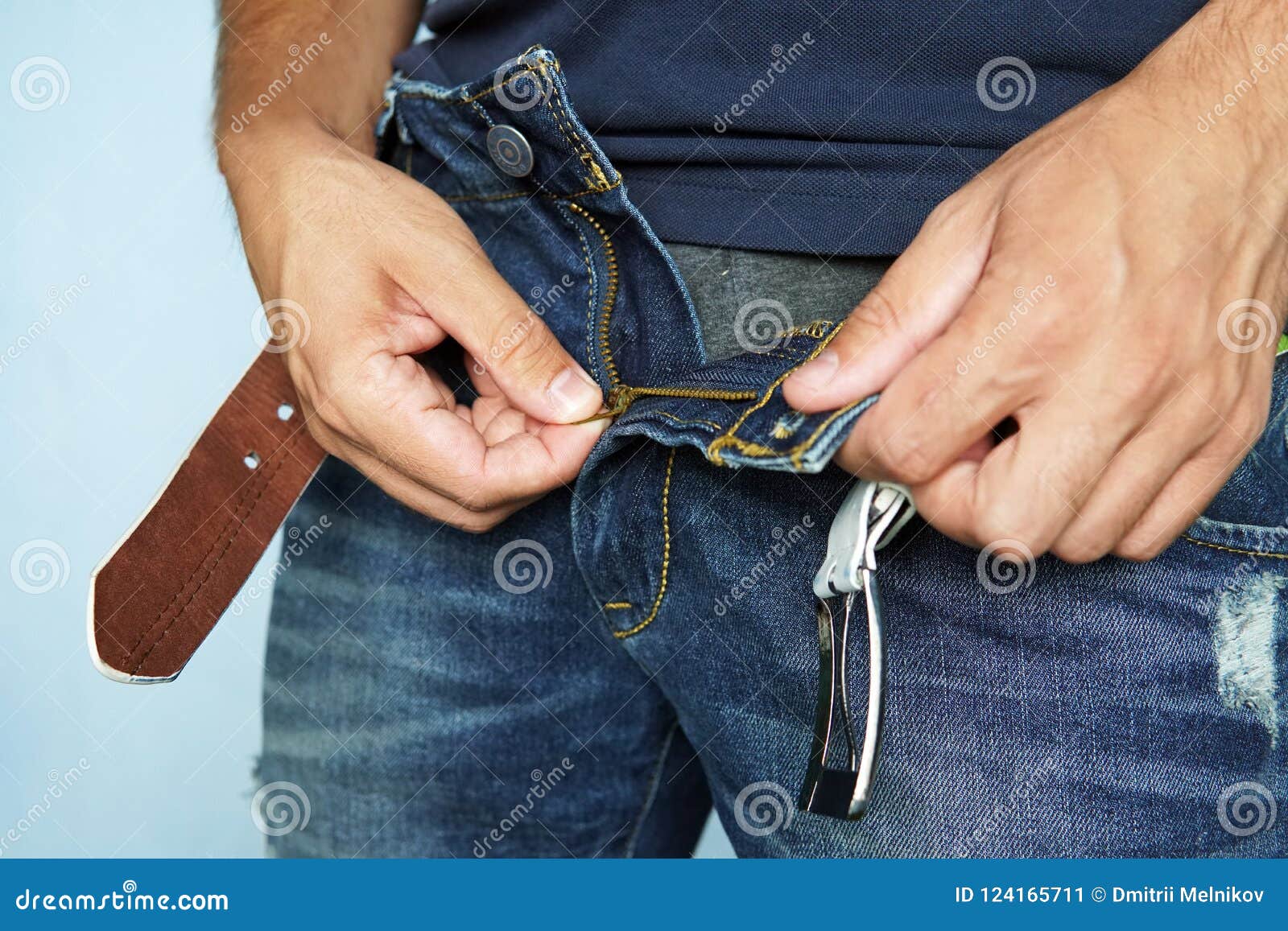 close up shot of man in jeans with open zipper