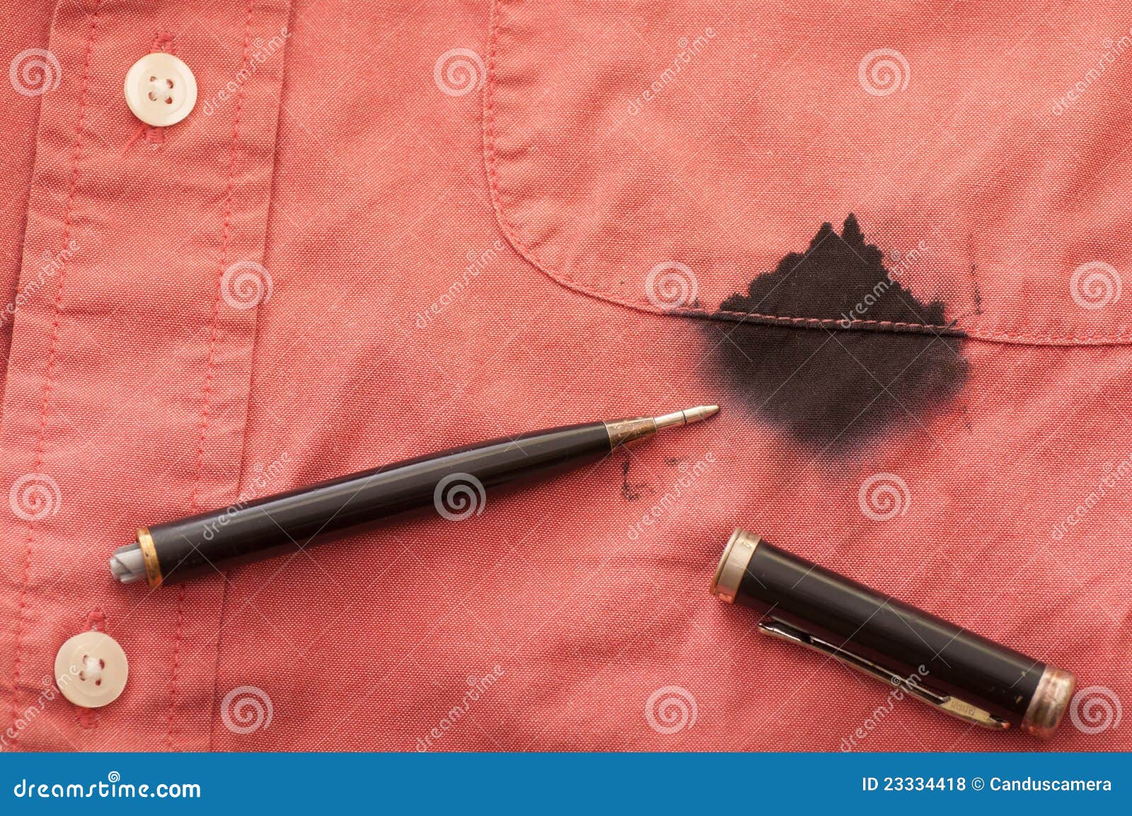 close up of man's stained shirt with broken pen