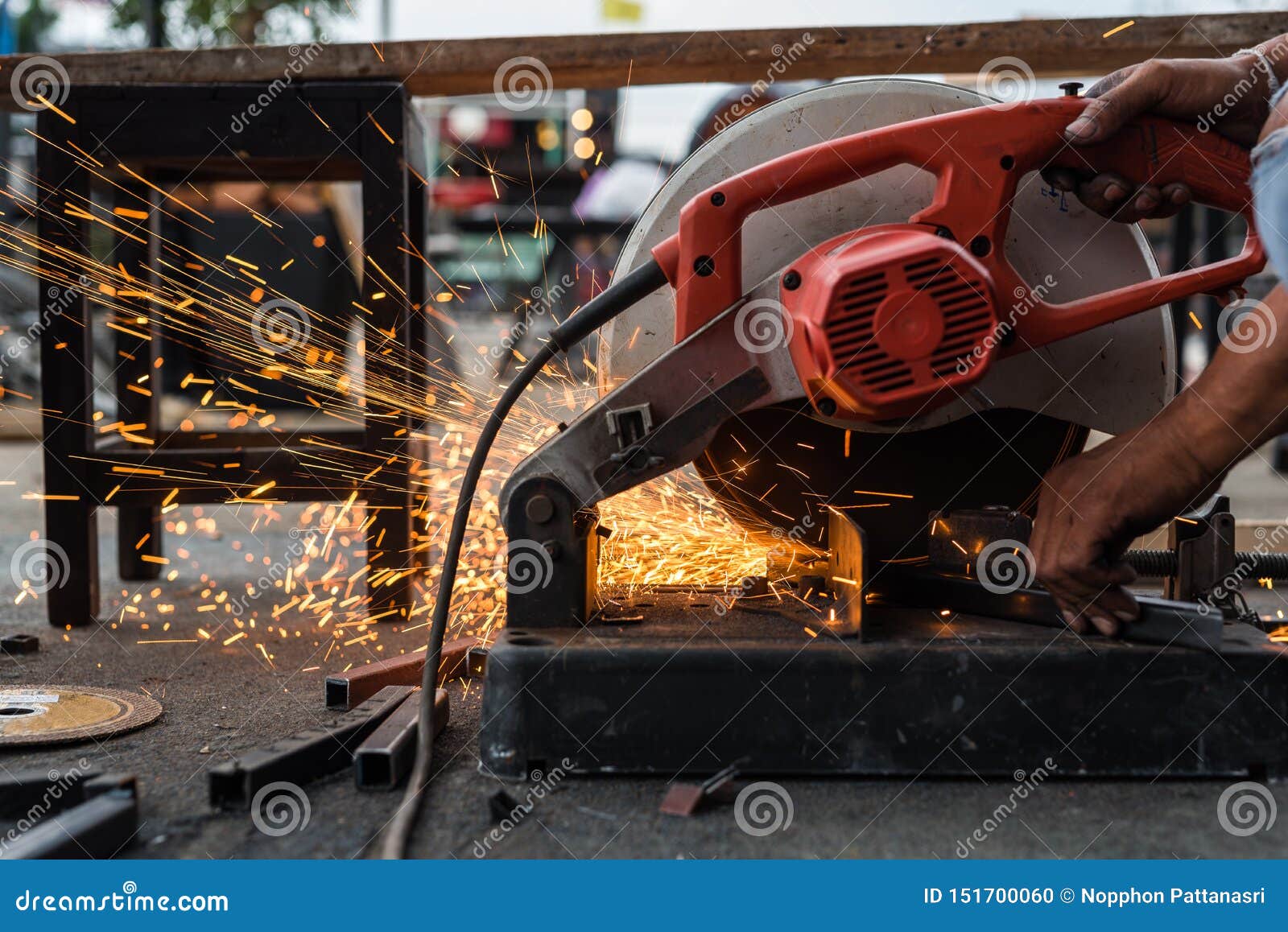 Close Up Man Using Machine Cutting Steel Stock Photo - Image of