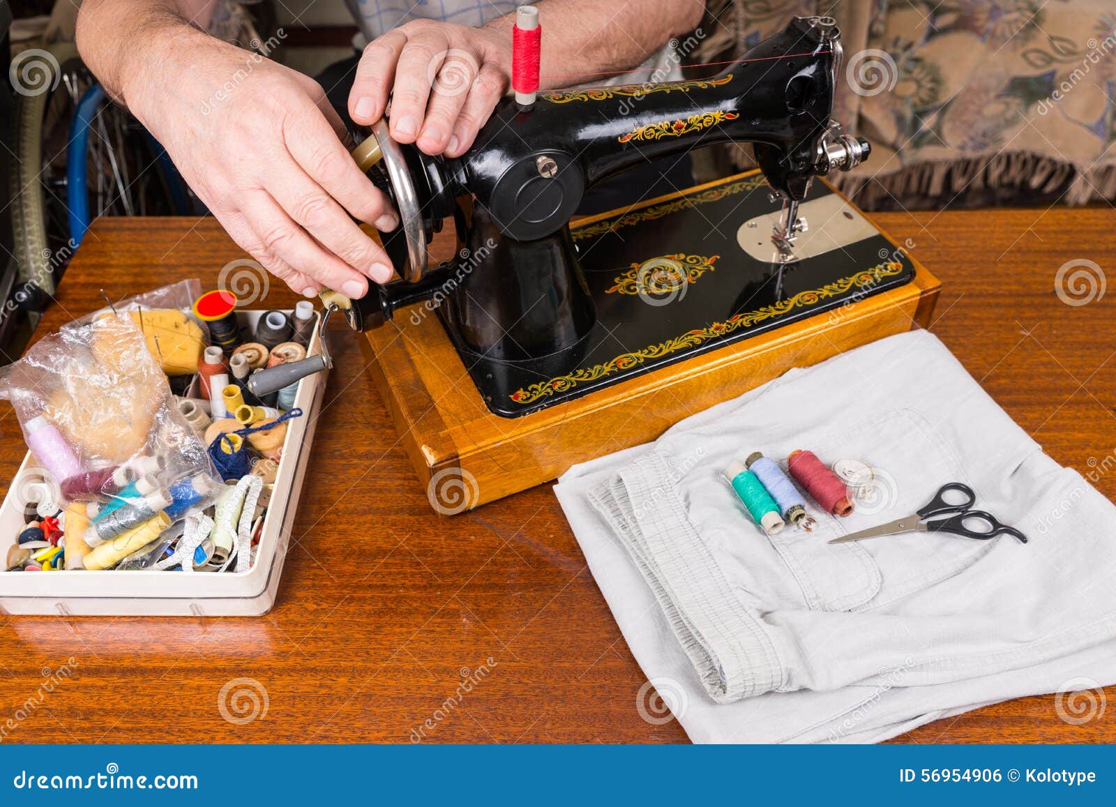 Close Up of Man Using Old Fashioned Sewing Machine Stock Photo Image
