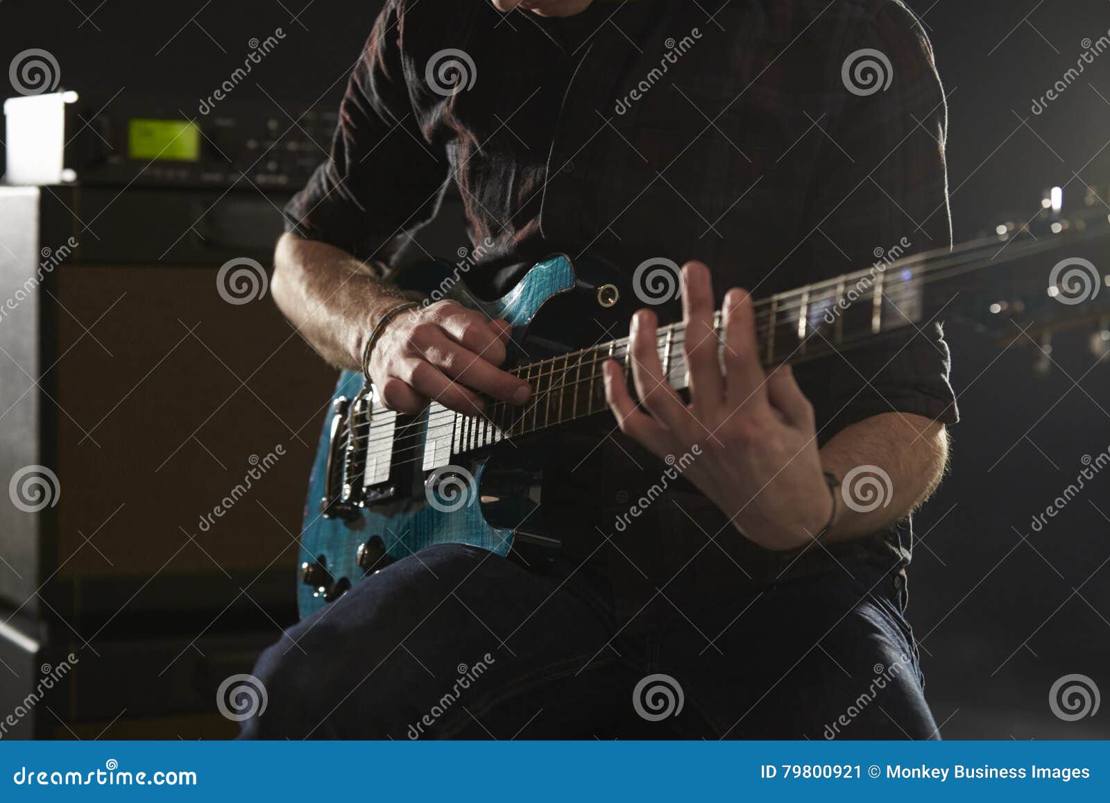 Close Up of Man Using Tapping Technique on Electric Guitar Stock Image