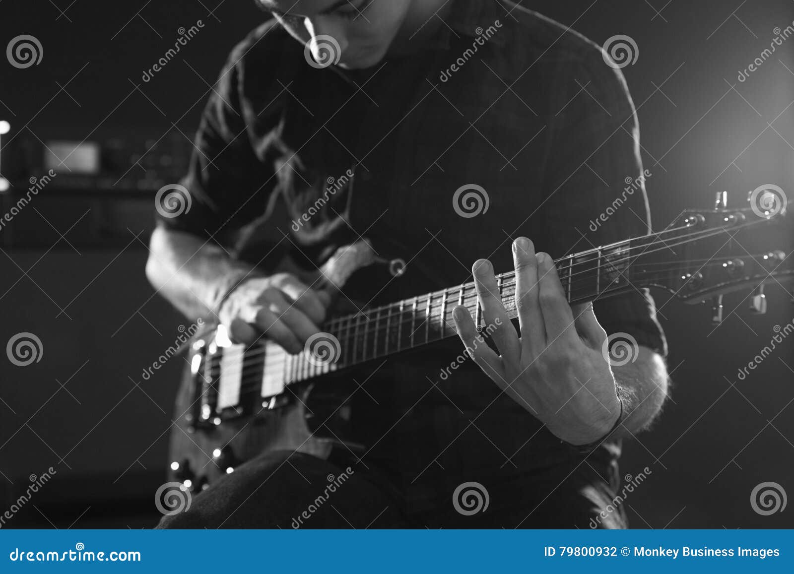 Close Up of Man Using Tapping Technique on Electric Guitar Stock Photo