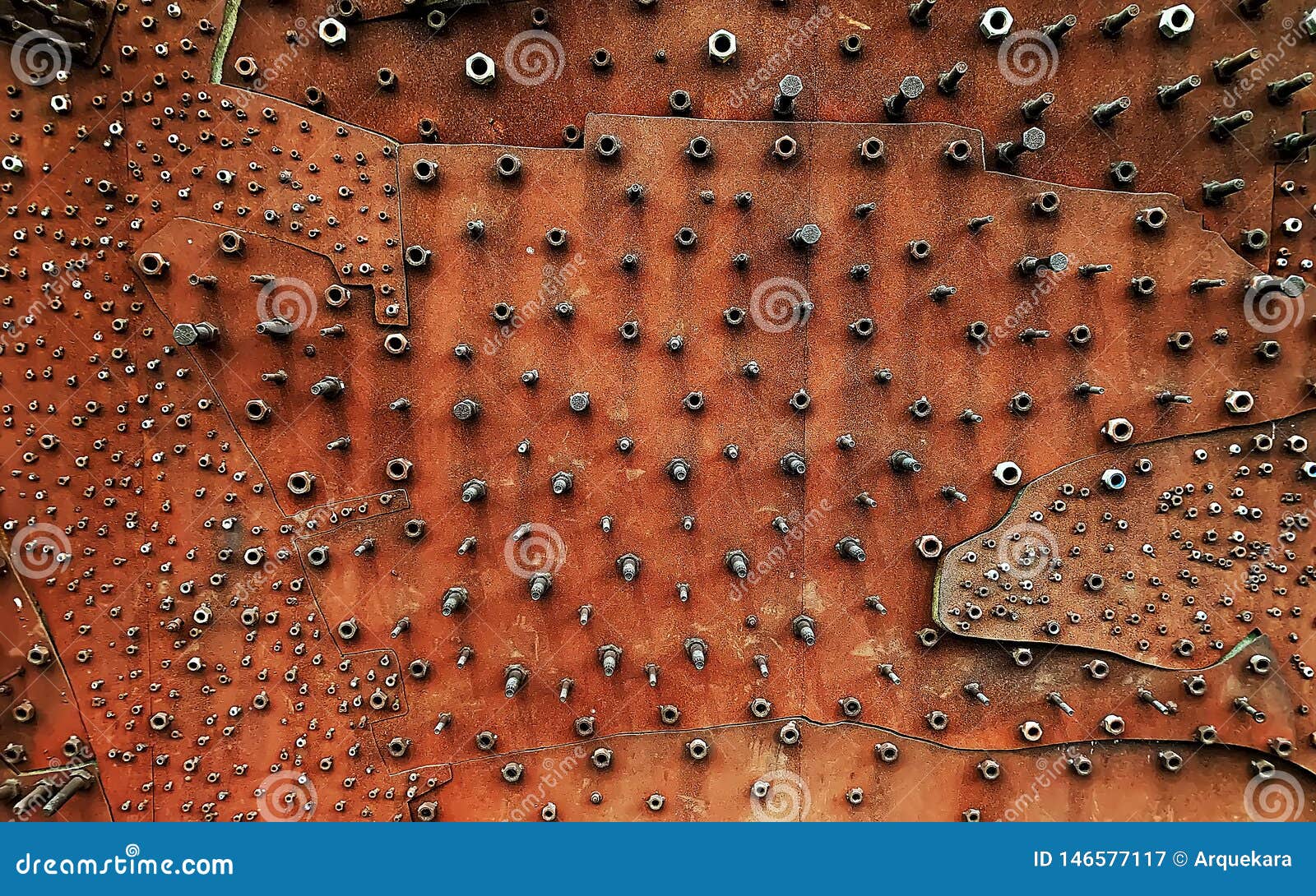 close up of many nuts on a copper wallboard