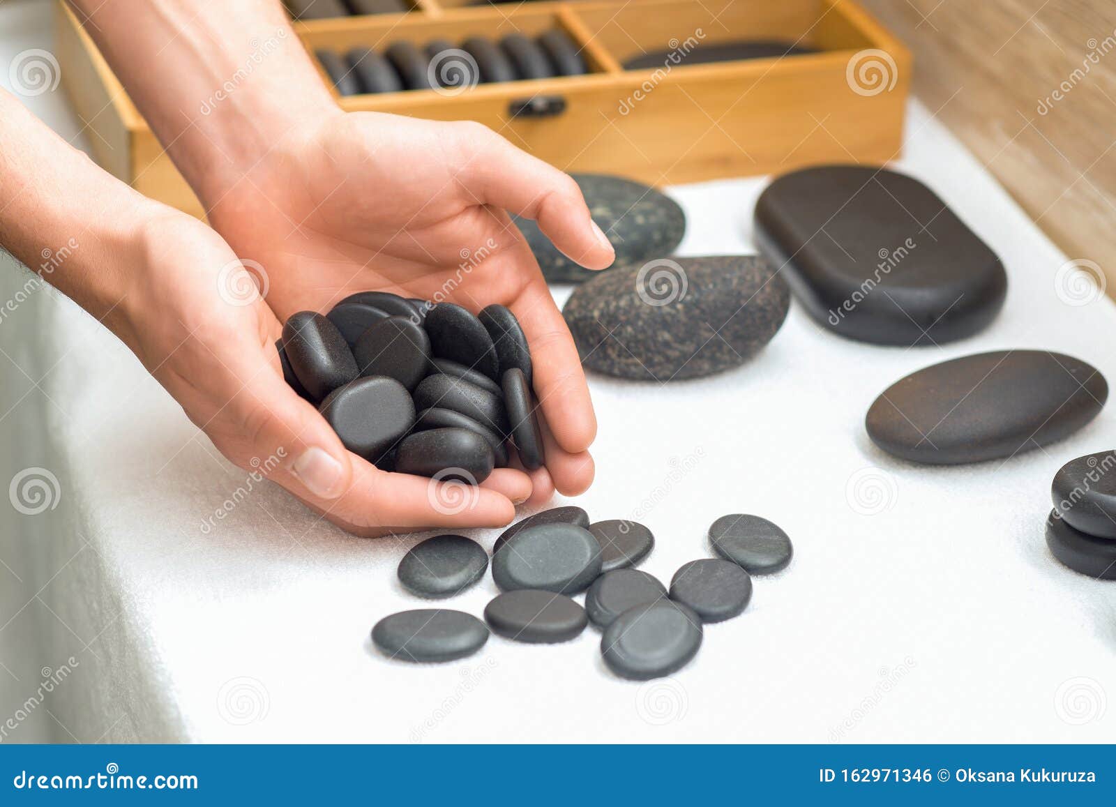Close Up of Massage Black Stones in Man`s Hands Stock Photo Image of massage, health 162971346