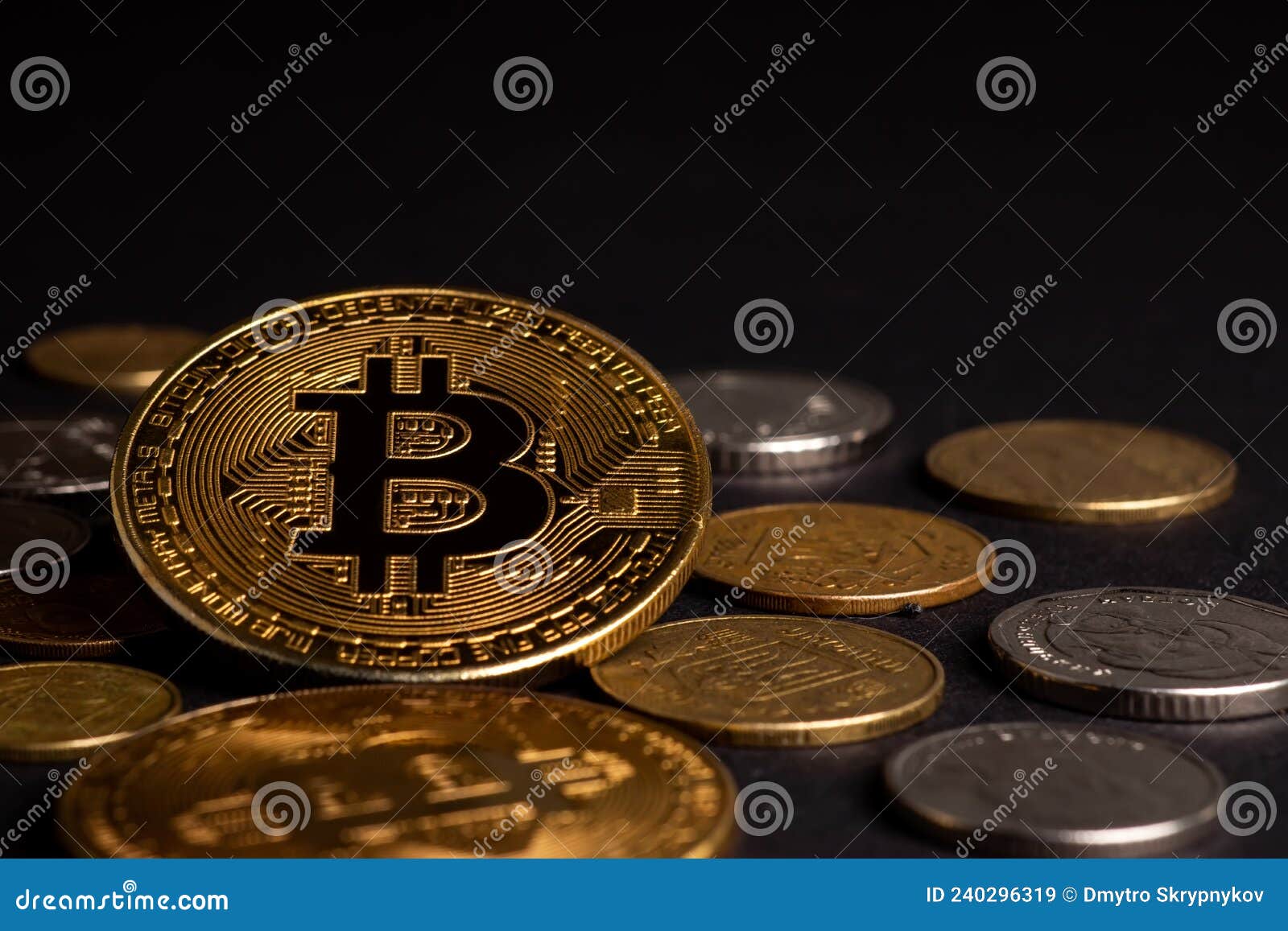 close up of metal shiny bitcoin crypto currency coin with ukrainian hryvnia coins. electronic decentralized money concept.