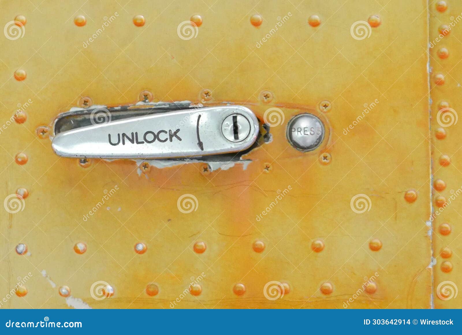 Closeup of a Metallic Latch with the Word Unlock Stock Photo Image