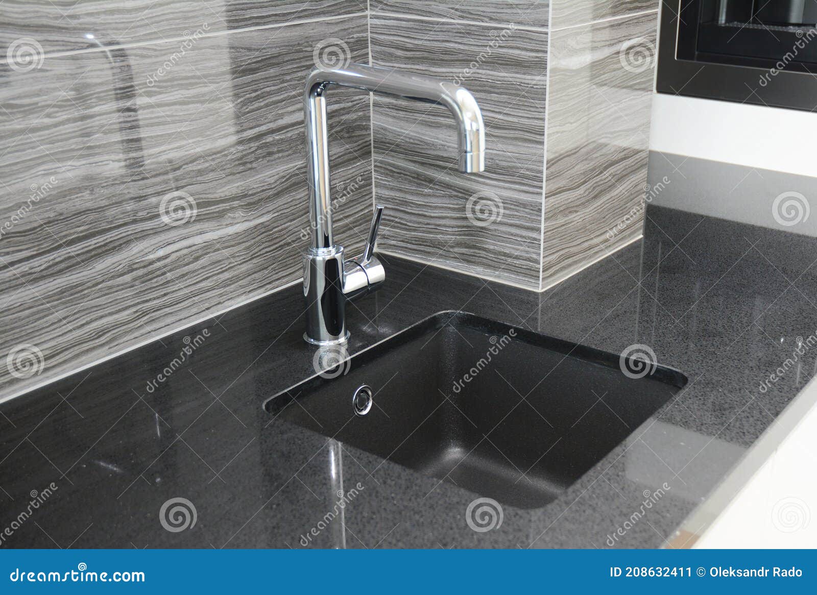 A Close-up on a Modern Kitchen Tiled Up with Gray Ceramic Wall ...