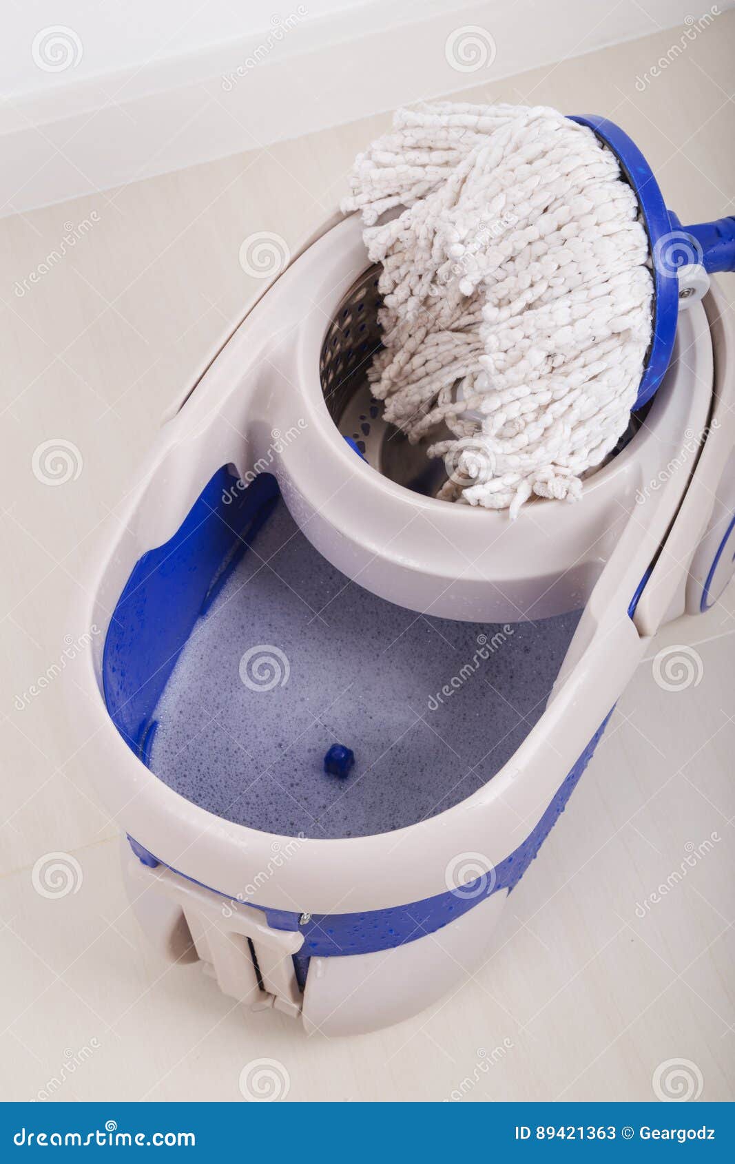 Close Up of Mop and Blue Bucket for Cleaning Floor Stock Image Image