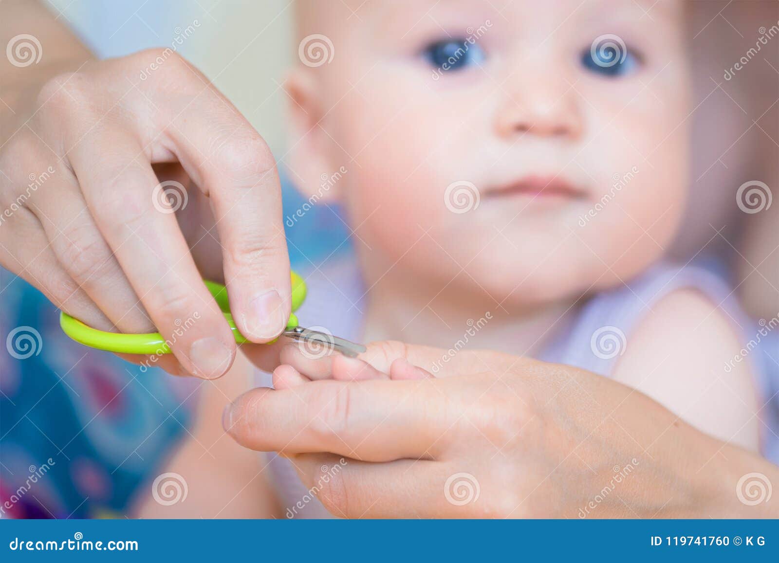 Close-up Mother Cutting Nail Of Baby With Safety Scissors ...