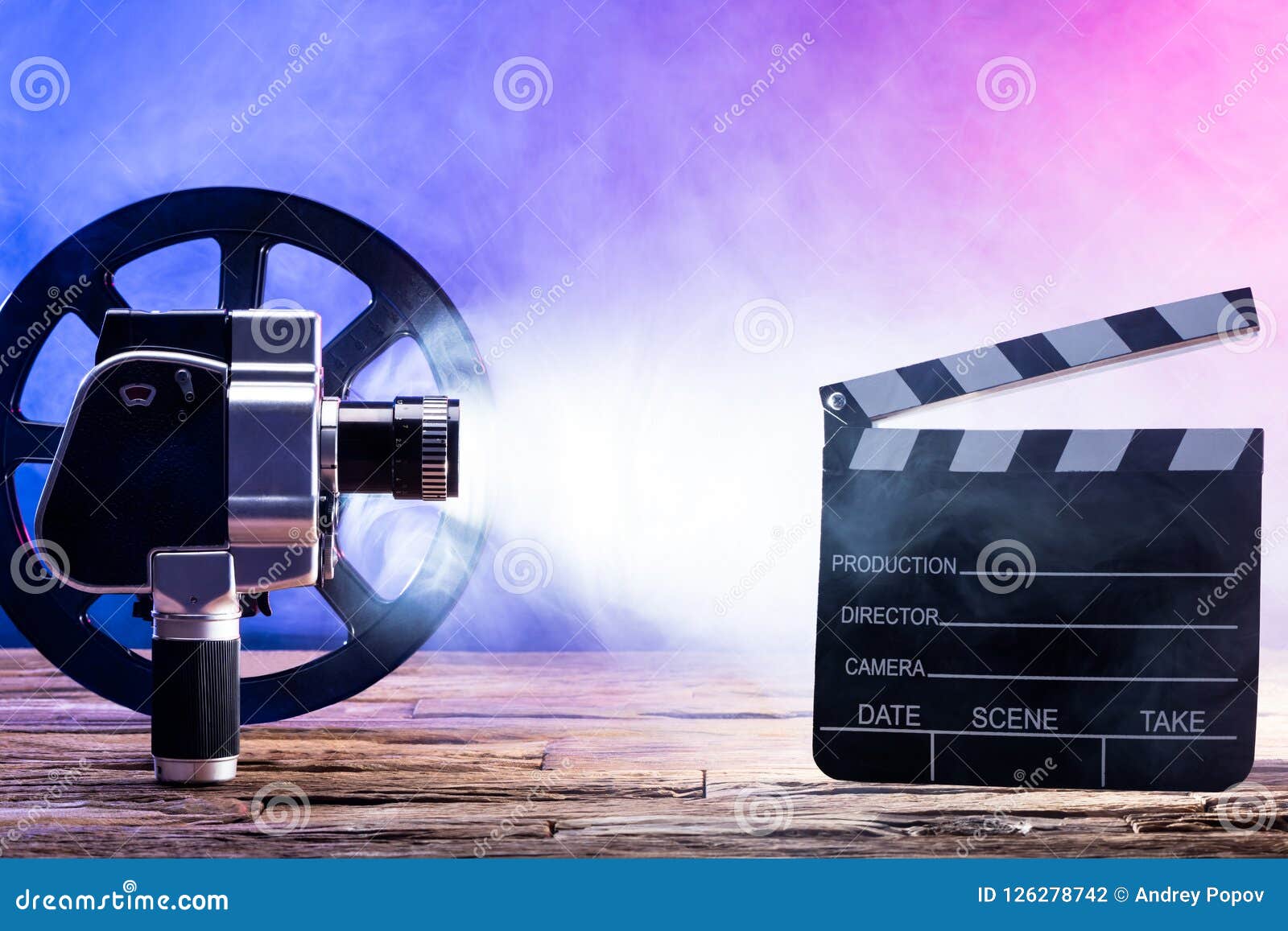 Close-up of Movie Camera with Film Reel and Clapper Board Stock