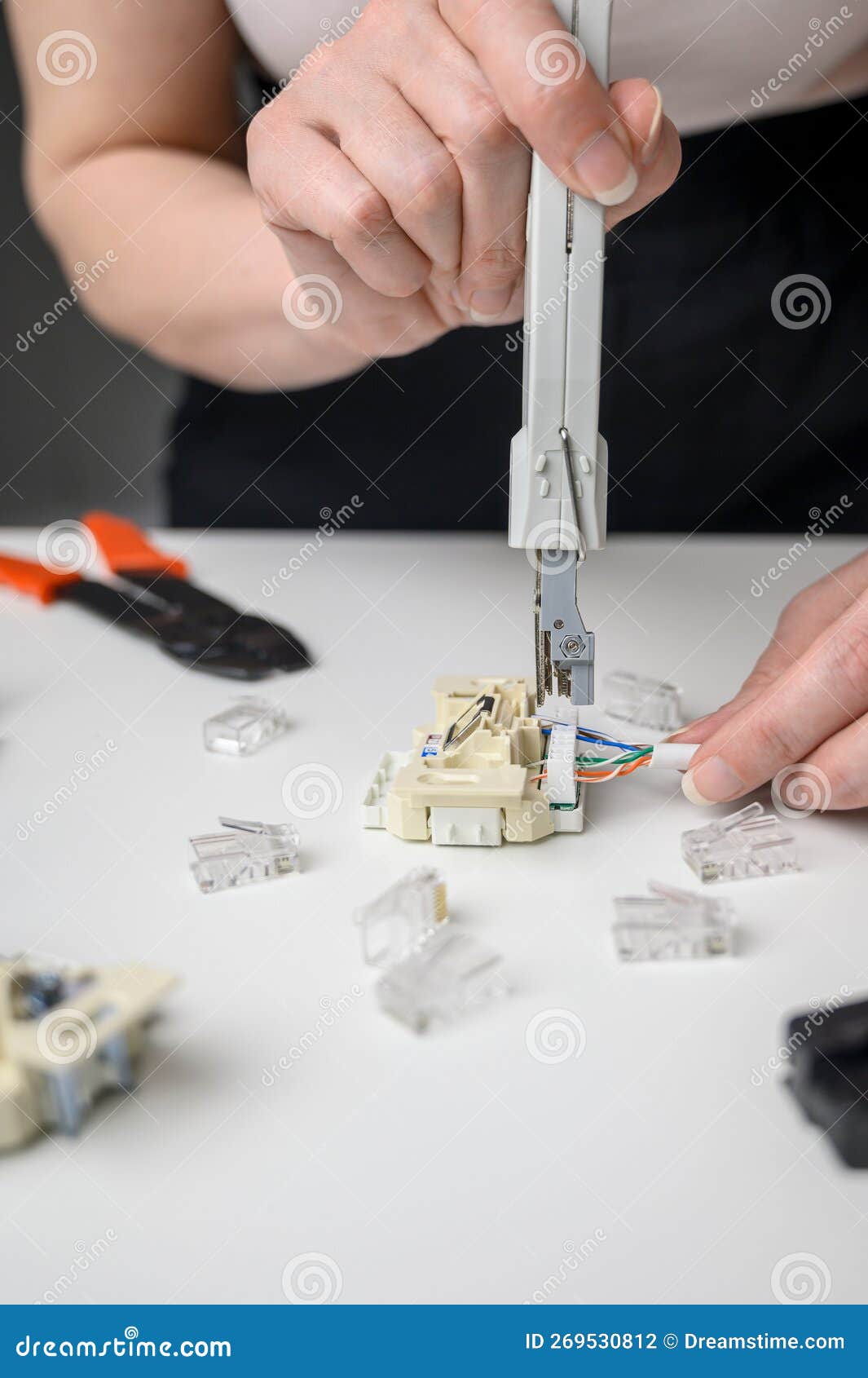 Closeup of a Network Cable Laying Tool. Used To Mount the Data Cable