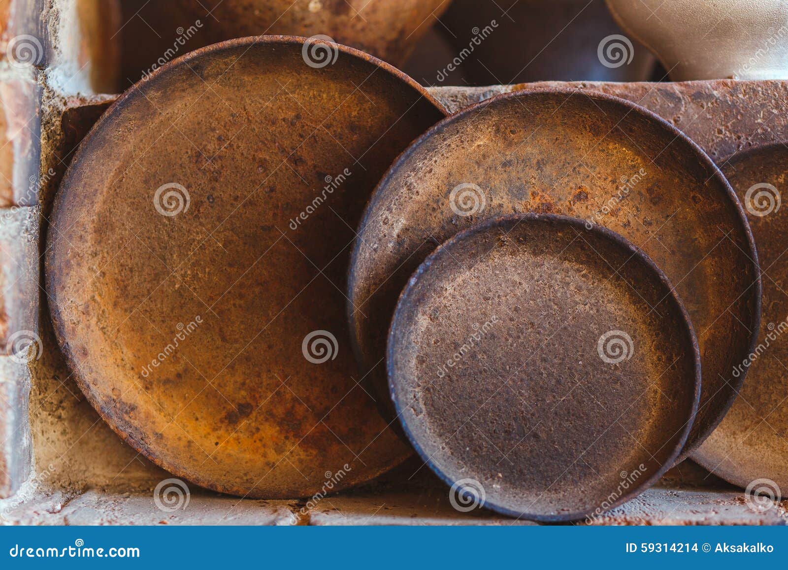 Close Up of Old Pots and Pans Stock Photo Image of brick, container