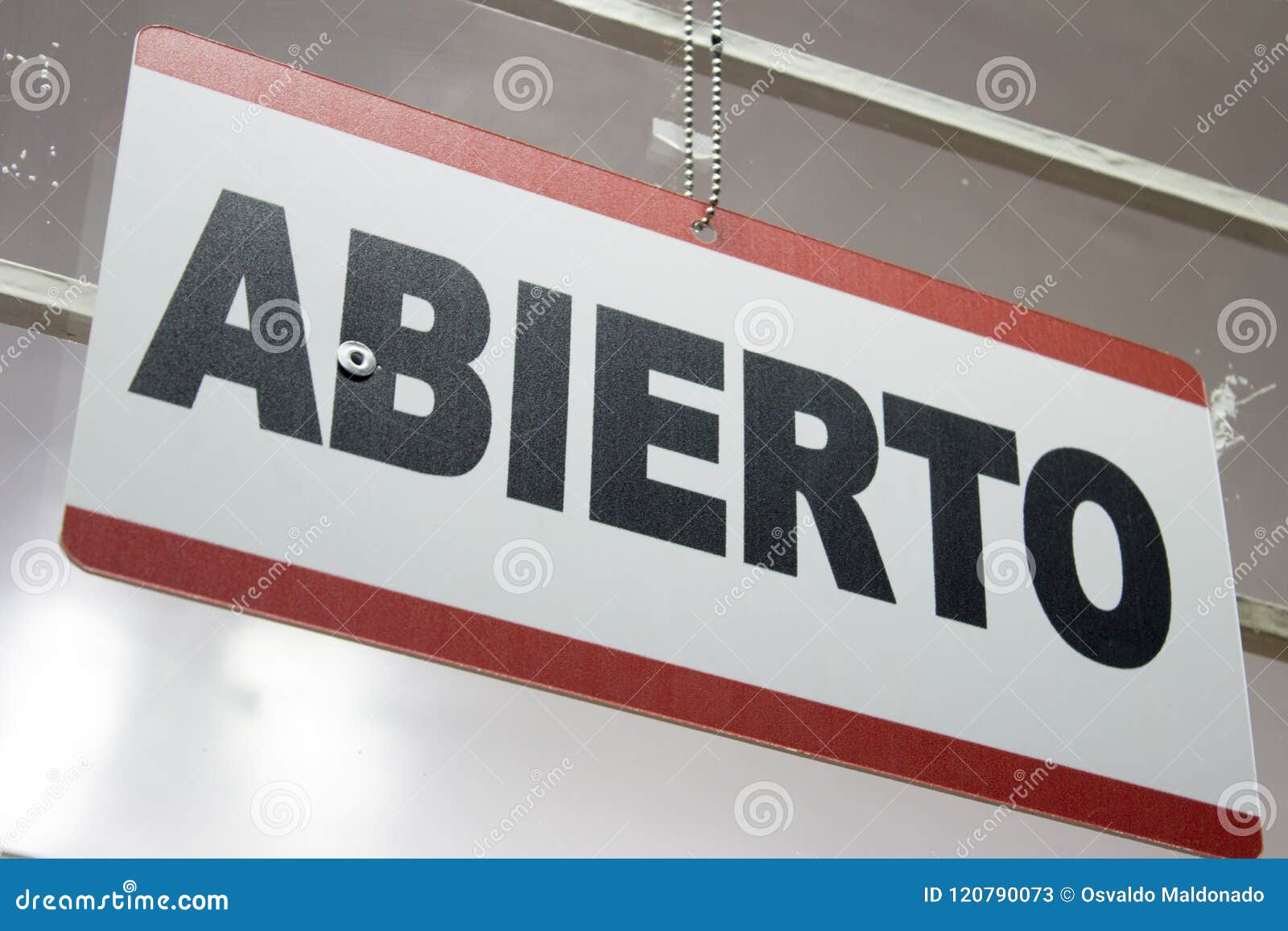 close-up of an open sign in spanish. `abierto`