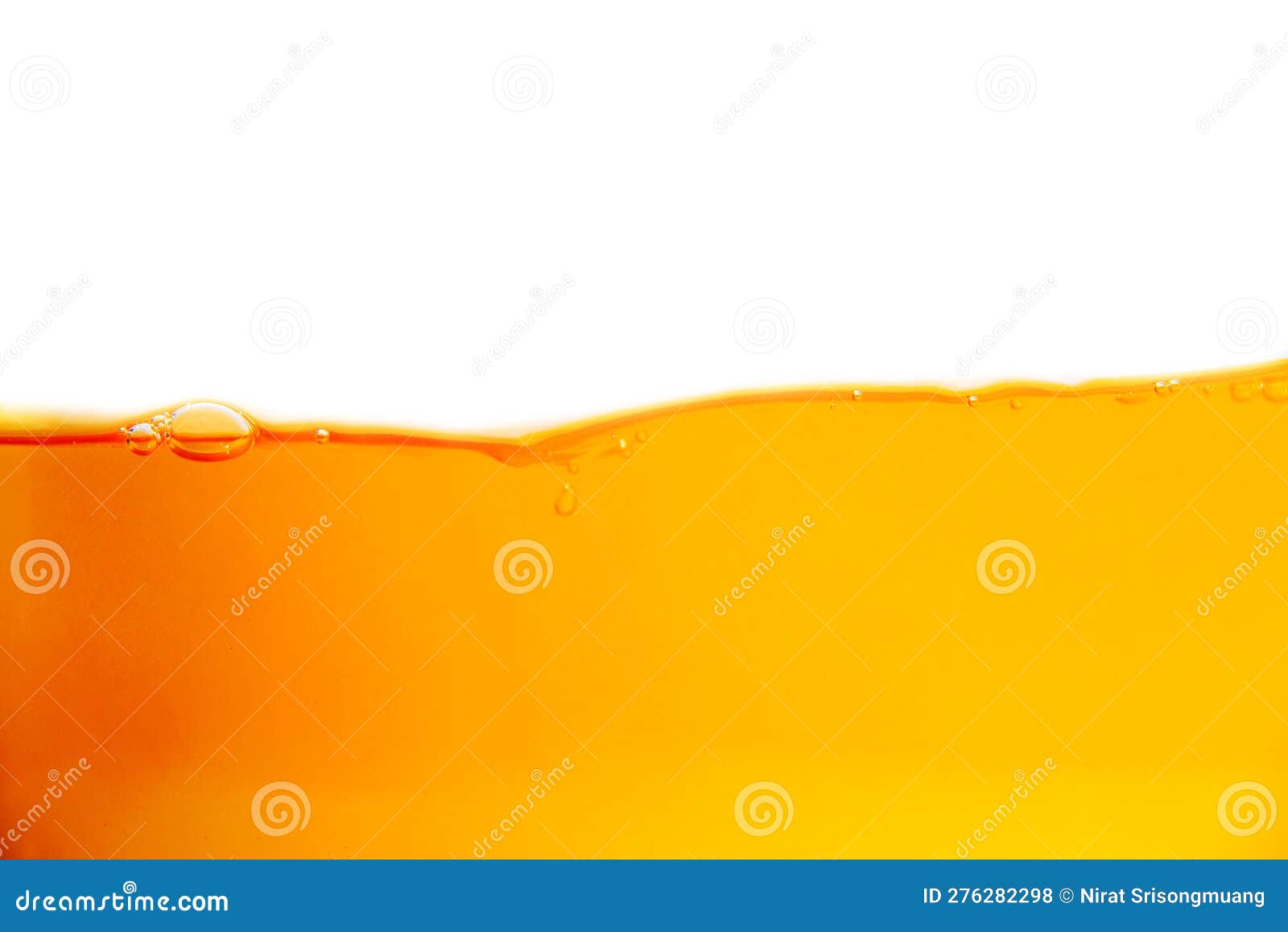 Closeup Orange Juice with Bubbles on a White Background. Stock