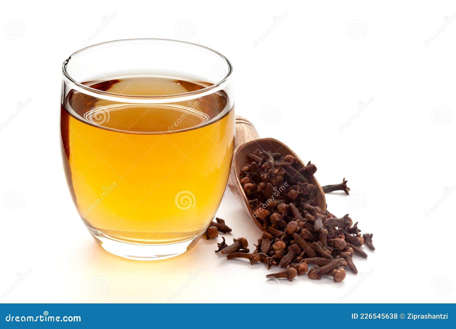 close-up of organic boiled water tea or kada  of  clove syzygium aromaticum  in a transparent glass cup over white background